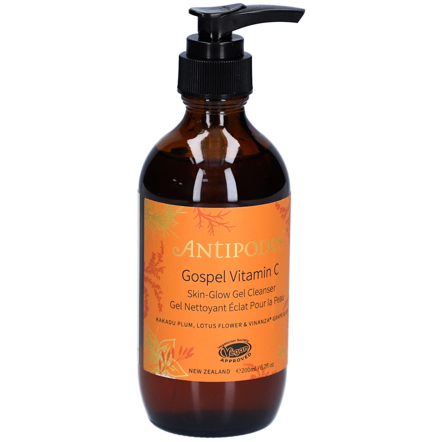 Flacon en verre brun avec pompe noire. Étiquette orange avec nom du produit et texte. Certification végétalienne.