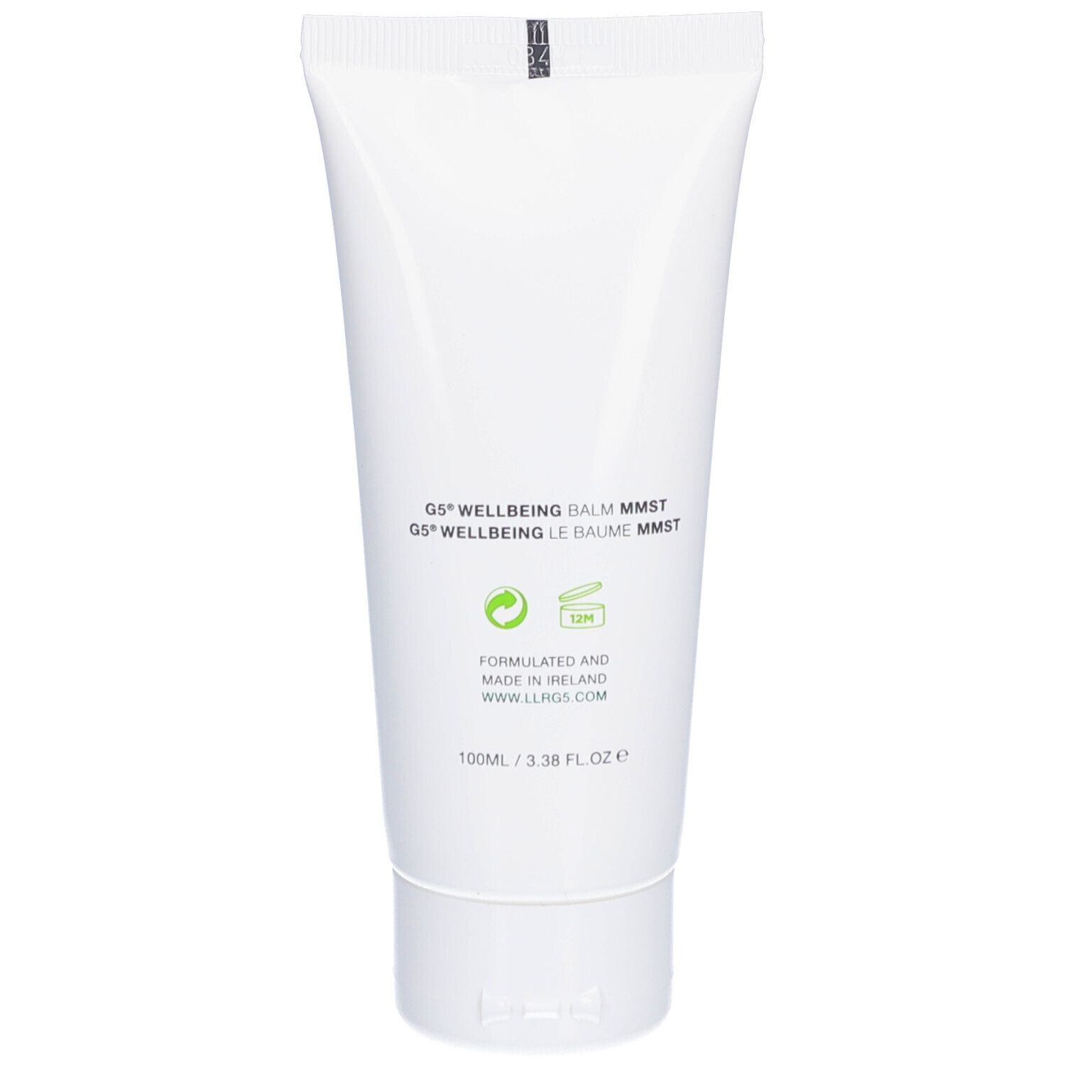 Dos d'un tube blanc. Texte multilingue. Contient des informations sur les ingrédients et le fabricant.