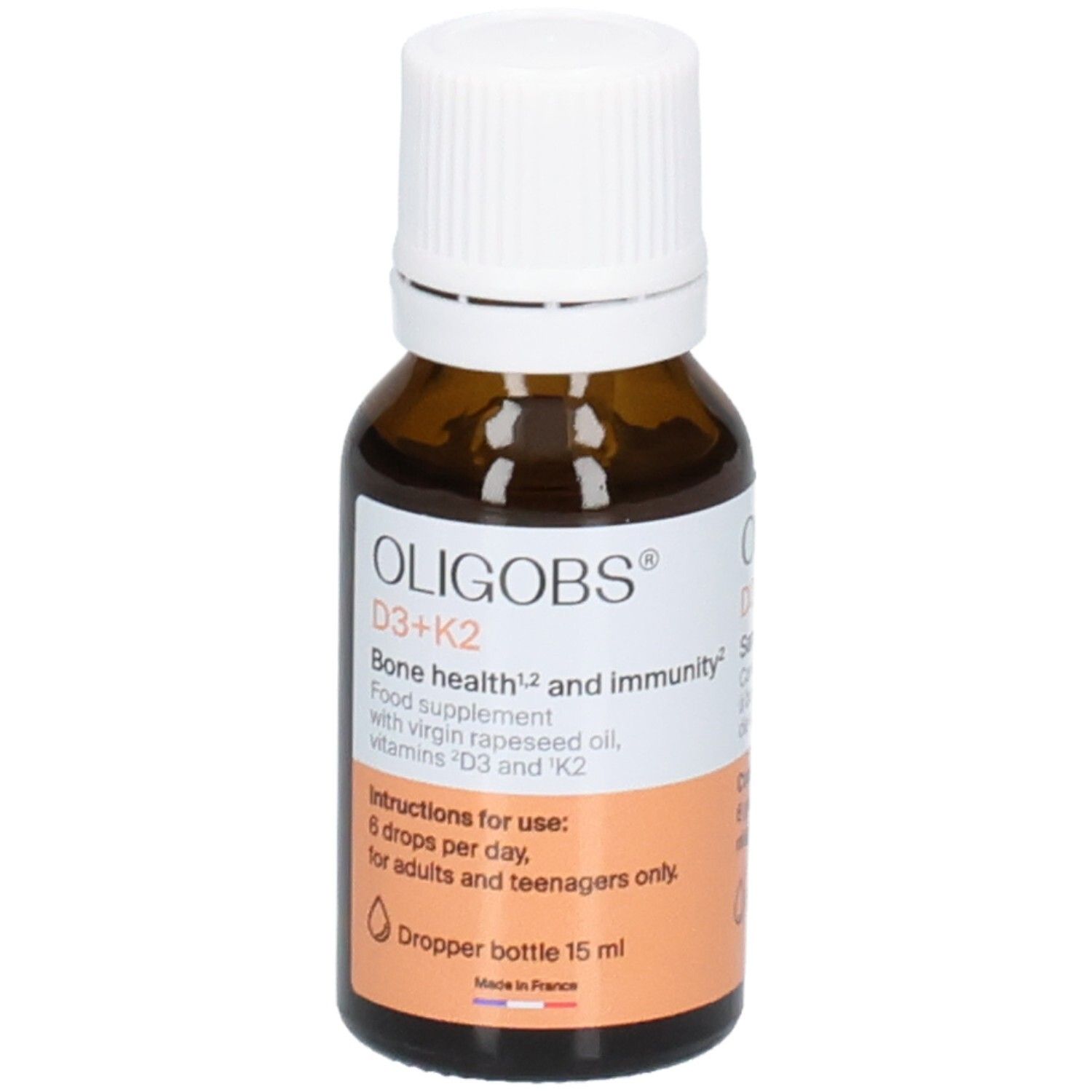 Bernsteinfarbene Glasflasche mit weißem Tropfverschluss. OLIGOBS D3+K2, Nahrungsergänzungsmittel mit Vitaminen.