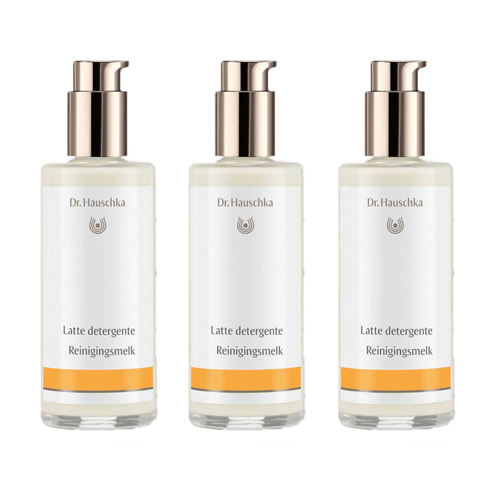 Trois flacons avec pompe. Sur chaque flacon, on lit "Dr. Hauschka" et "Latte detergente Reinigingsmelk". Une bande orange est visible en bas.