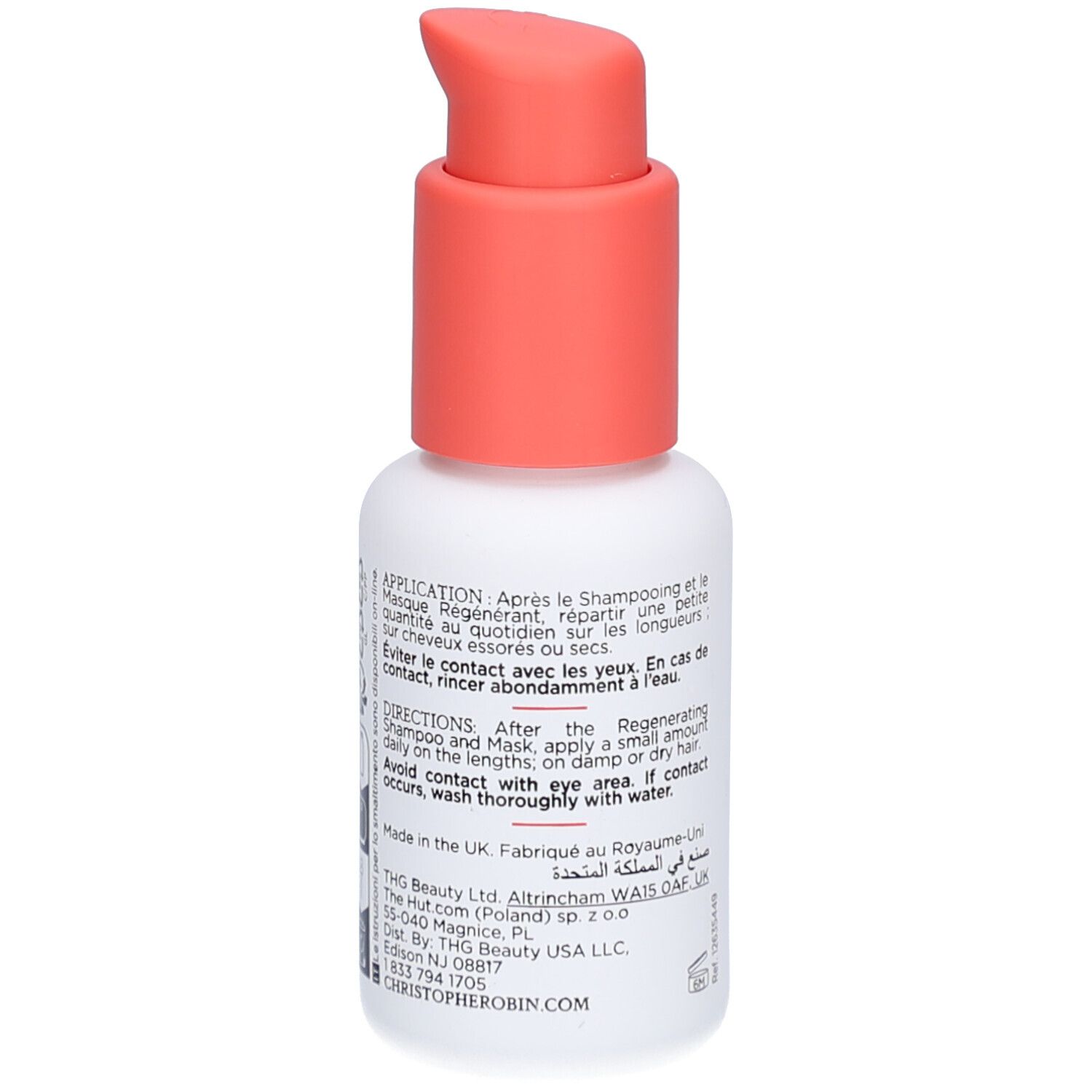 Dos du flacon blanc avec pompe rouge. Texte multilingue, dont anglais et arabe.