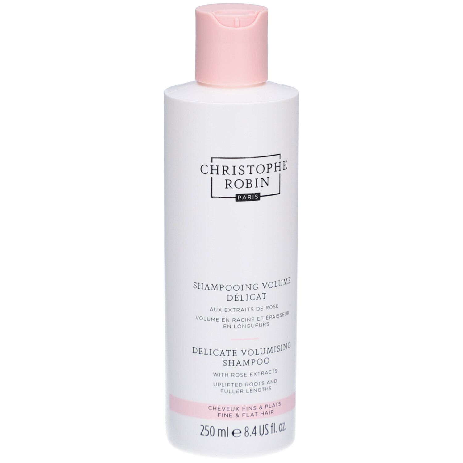 Weiße Flasche mit rosa Verschluss. Aufschrift: Christophe Robin Paris. Text: Shampooing Volume Délicat, Delicate Volumising Shampoo.