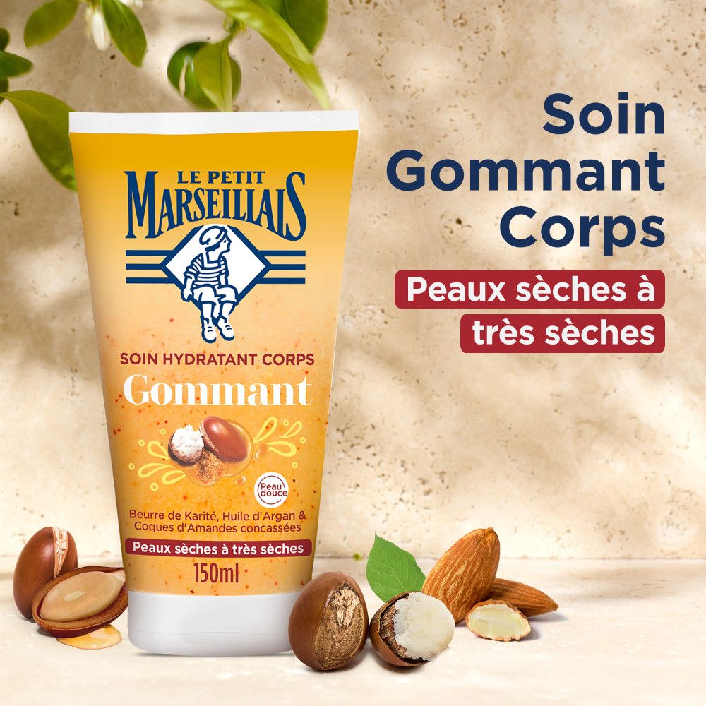 Tube jaune avec produit. Texte: Soin Gommant Corps, Peaux sèches à très sèches. Amandes, Beurre de Karité, Huile d'Argan.