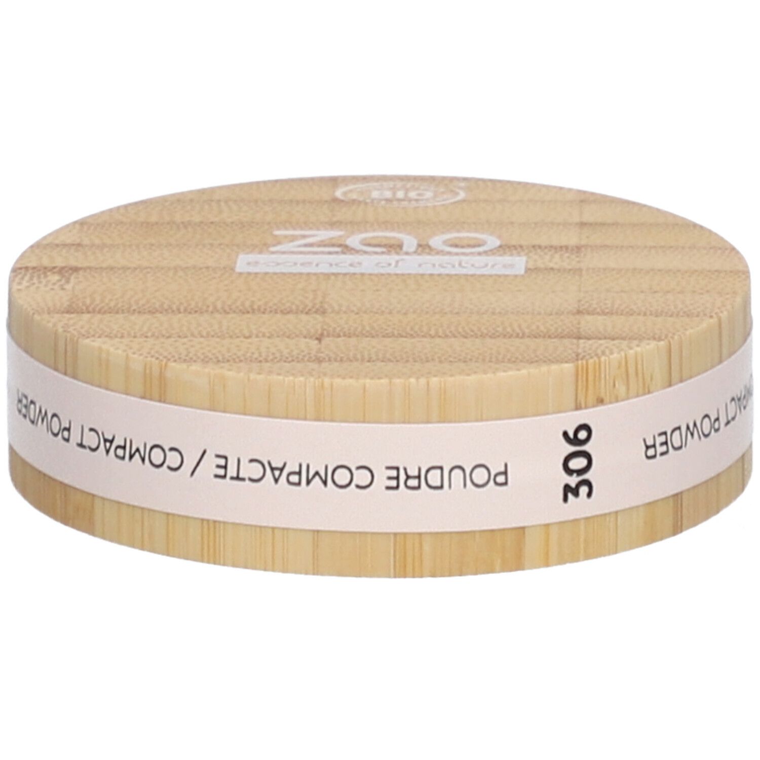 Boîtier rond de poudre compacte en bois. Inscriptions : ZAO, essence of nature, 306, Poudre Compacte / Compact Powder.