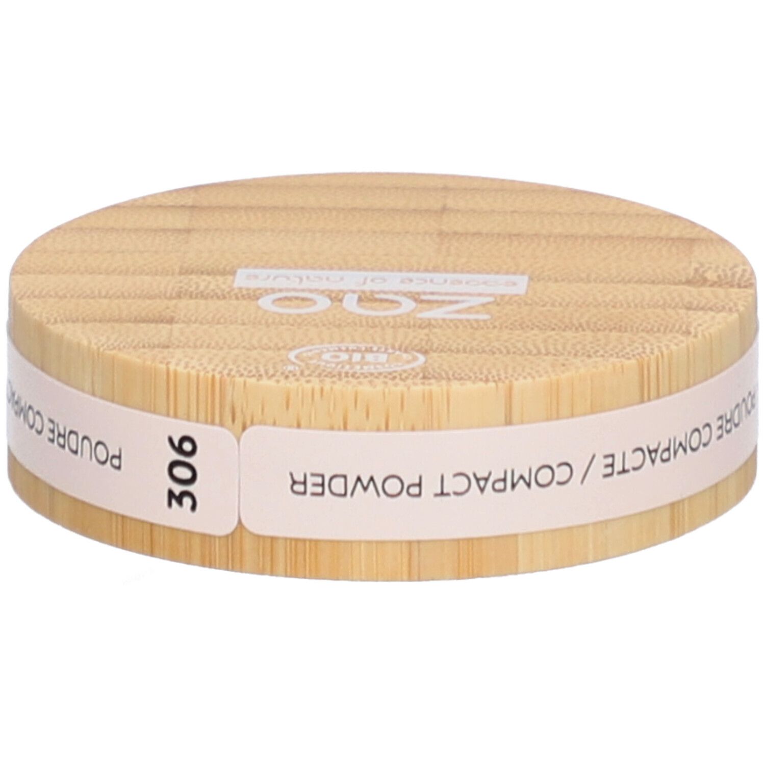 Boîtier rond de poudre compacte en bois. Inscriptions : ZAO, essence of nature, 306, Poudre Compacte / Compact Powder.