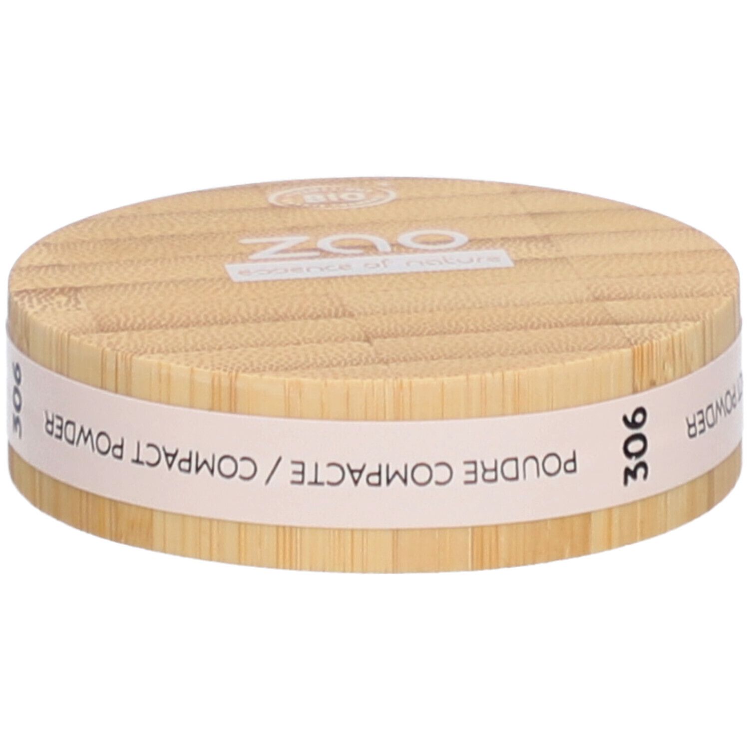 Boîtier rond de poudre compacte en bois. Inscriptions : ZAO, essence of nature, 306, Poudre Compacte / Compact Powder.