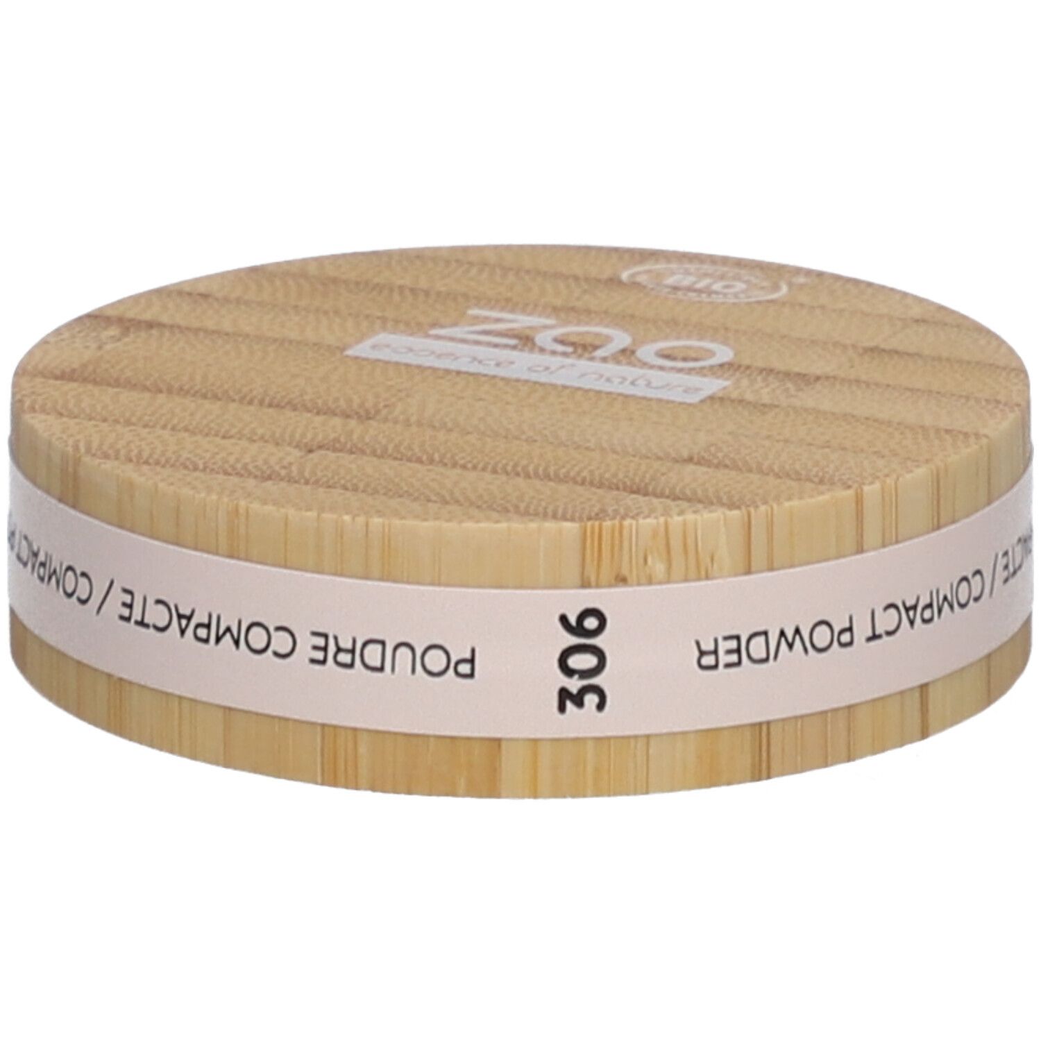 Boîtier rond de poudre compacte en bois. Inscriptions : ZAO, essence of nature, 306, Poudre Compacte / Compact Powder.