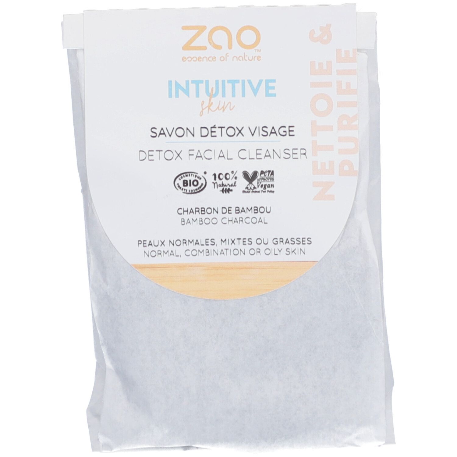 Emballage avec informations produit. Texte: "ZAO", "Savon Détox Visage", "Charbon de Bambou". Labels bio et vegan.