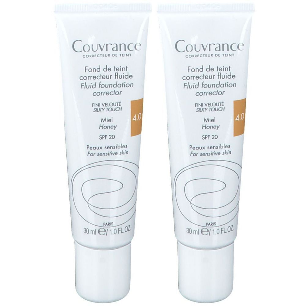 Deux tubes de fond de teint fluide Couvrance. Blancs, avec texte et teinte 4.0. Pour peaux sensibles, avec SPF 20.