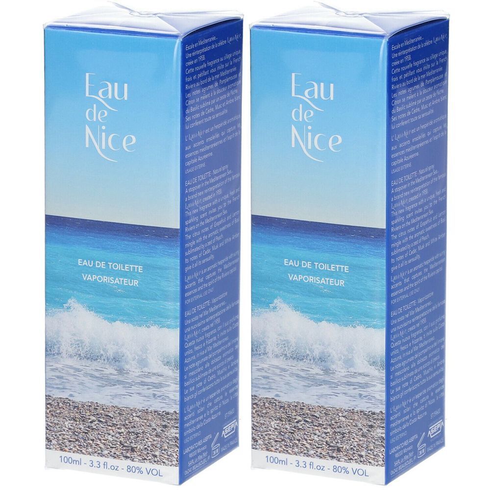 Zwei blaue Kartons mit "Eau de Nice"-Schriftzug. Aufdruck: "EAU DE TOILETTE VAPORISATEUR". Abbildung von Meer und Strand.