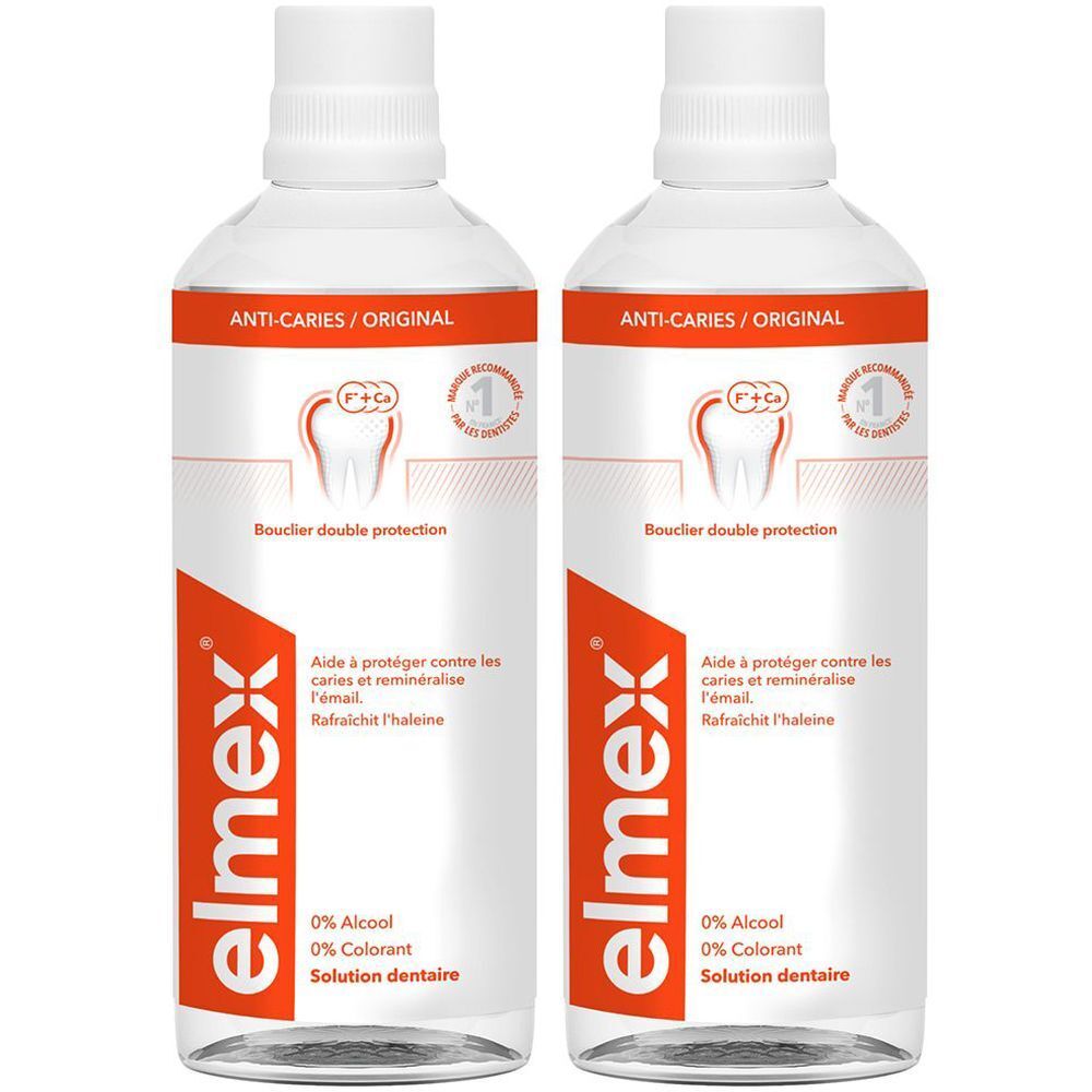Deux flacons de solution dentaire elmex® Anti-caries. Flacons blancs avec texte rouge et blanc. Inscription : Anti-caries, 0% alcool, 0% colorant.