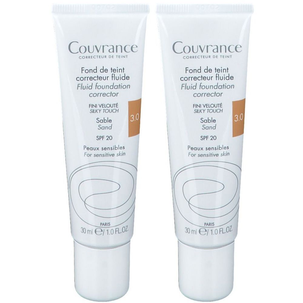 Deux tubes de fond de teint fluide. Blancs, avec inscription Couvrance, teinte 3.0, Sable, SPF 20. Pour peaux sensibles.