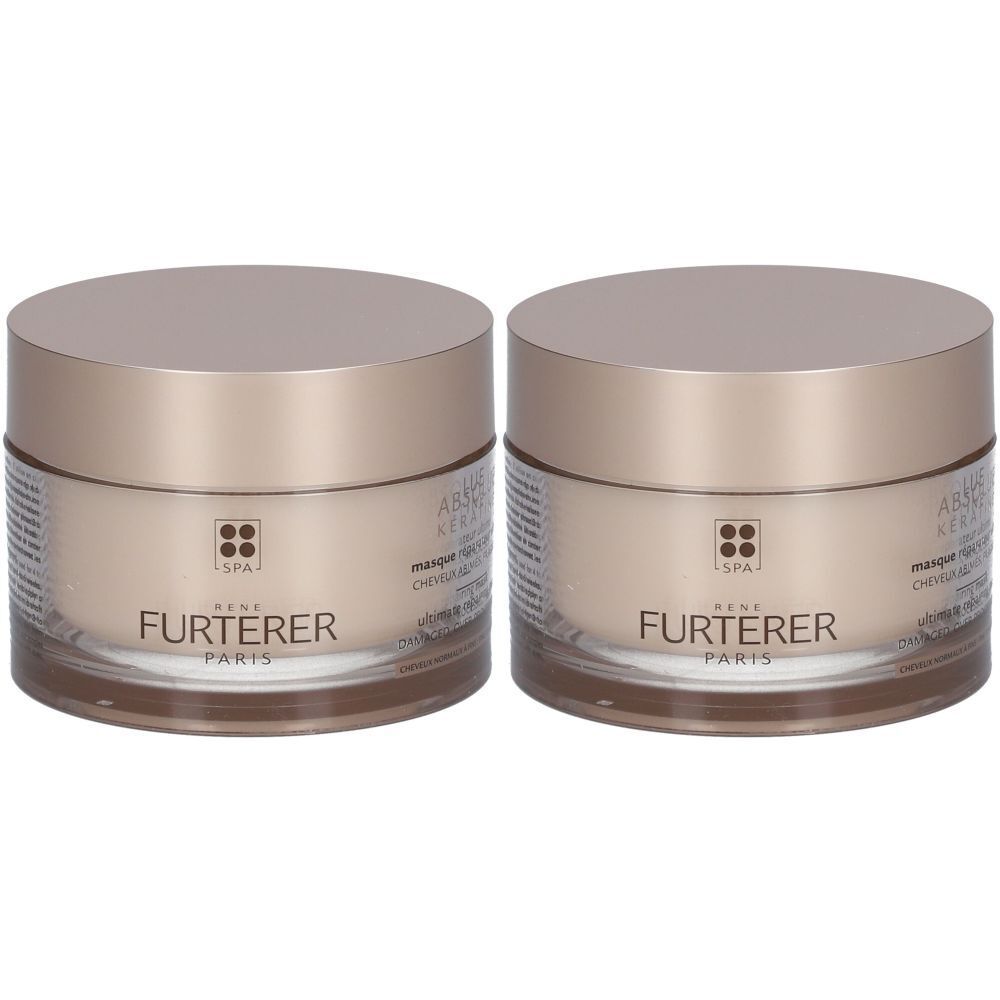 Deux pots avec couvercles dorés. Inscription "FURTERER PARIS" sur les pots.