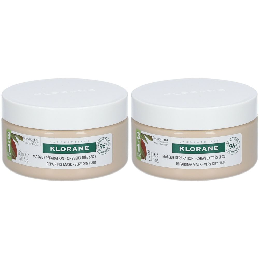 Deux pots crème avec couvercles blancs. Étiquettes avec "KLORANE" et "Masque Réparation - Cheveux très secs".