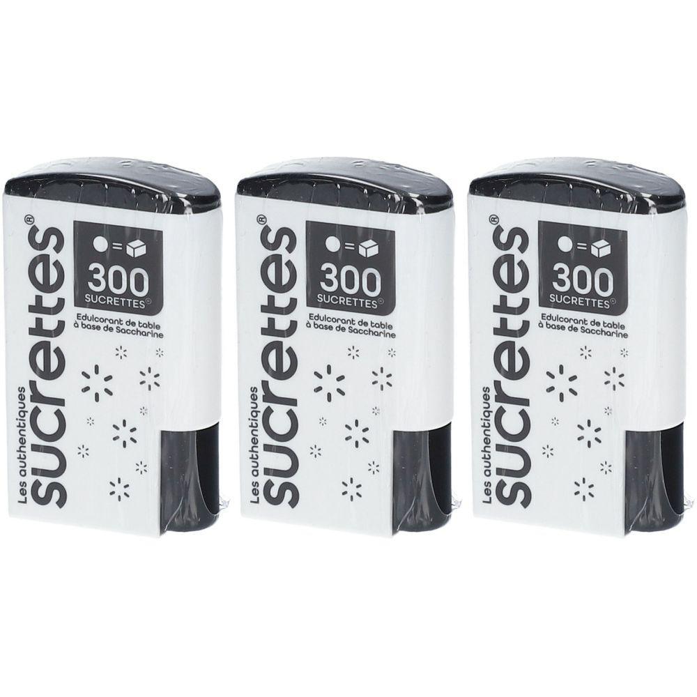 Drei weiße Spender mit schwarzem Deckel. Aufschrift: Les authentiques sucrettes, 300 Sucrettes. Sterne als Dekoration.