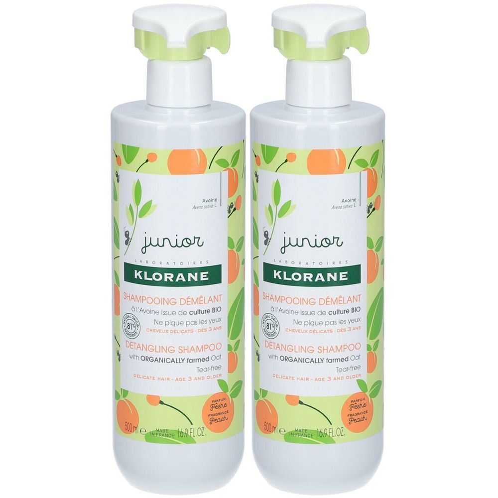 Zwei Flaschen Shampoo. Aufschrift: KLORANE, junior. Mit Pfirsich-Motiv und grünen Deckeln. Französische und englische Beschriftung.