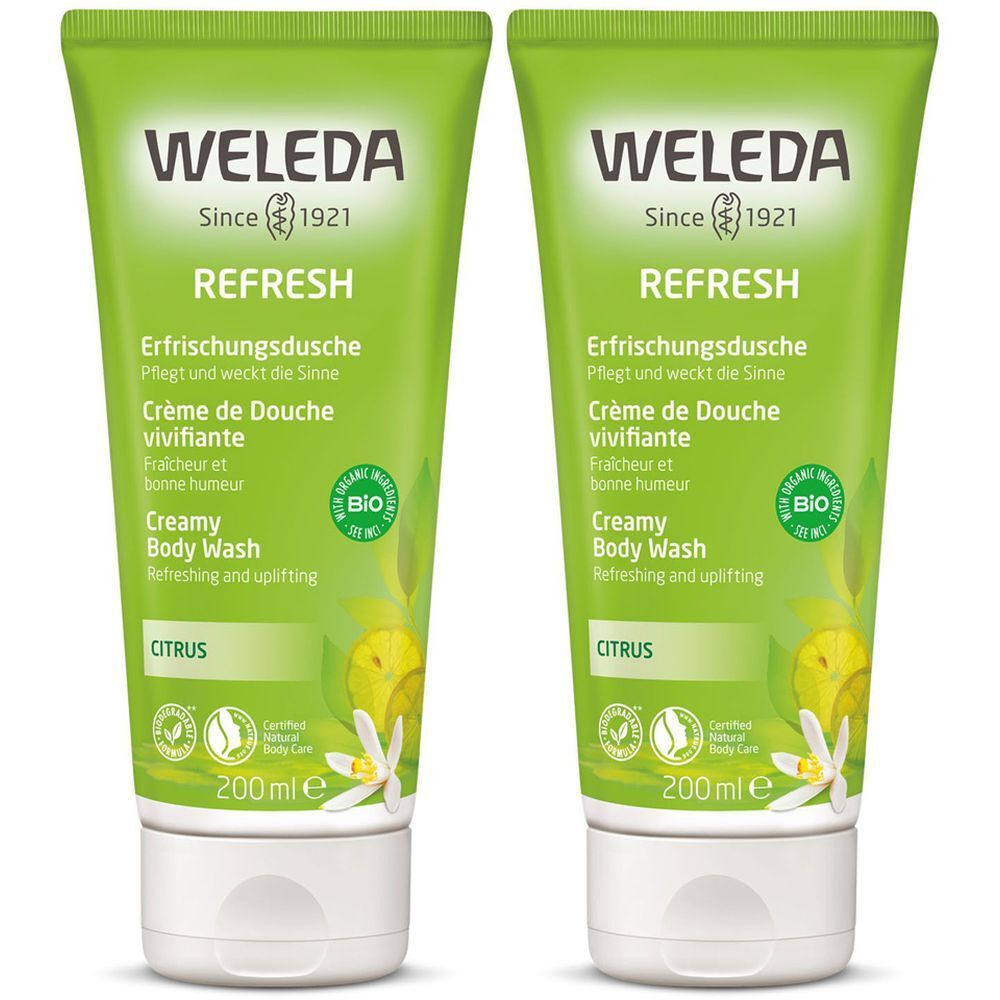 Zwei grüne Tuben mit weißem Verschluss. Aufschrift: WELEDA, REFRESH, Erfrischungsdusche, Creamy Body Wash. Mit Bio-Siegel und Zitrus-Motiv.