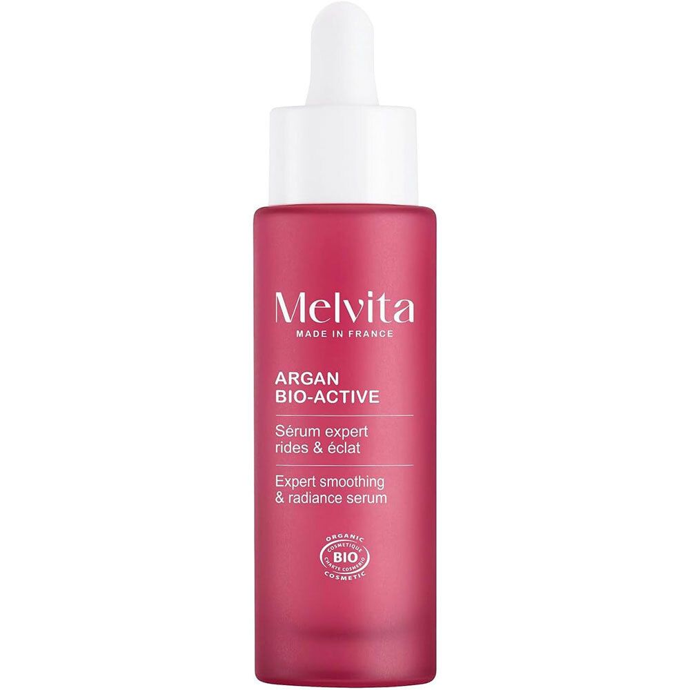 Flacon rouge avec bouchon et pipette blancs. Inscription : Melvita, Argan Bio-Active, Sérum expert rides & éclat.