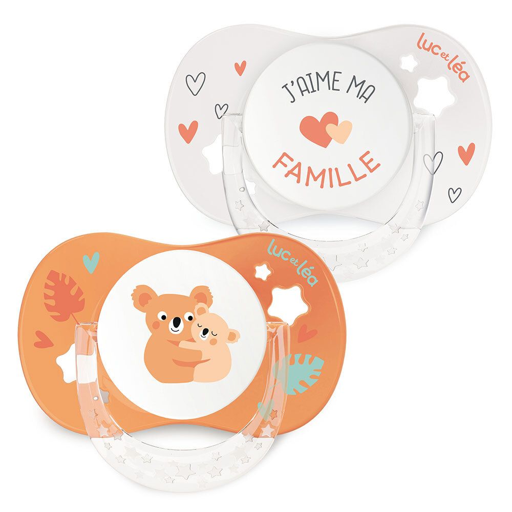 Zwei anatomische Schnuller. Einer weiß mit Aufdruck, der andere orange mit Koala-Motiv. Marke: Luc et Léa.
