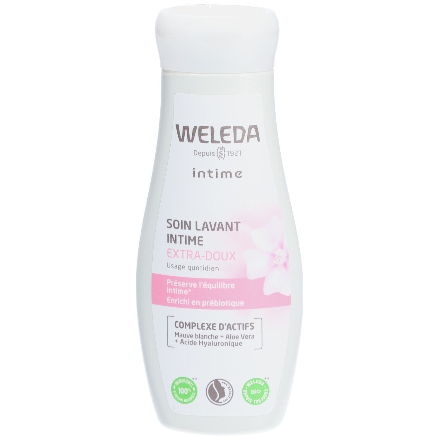 Flacon blanc "WELEDA Intime". Étiquette rose avec nom du produit et fleur. Sceau vert.