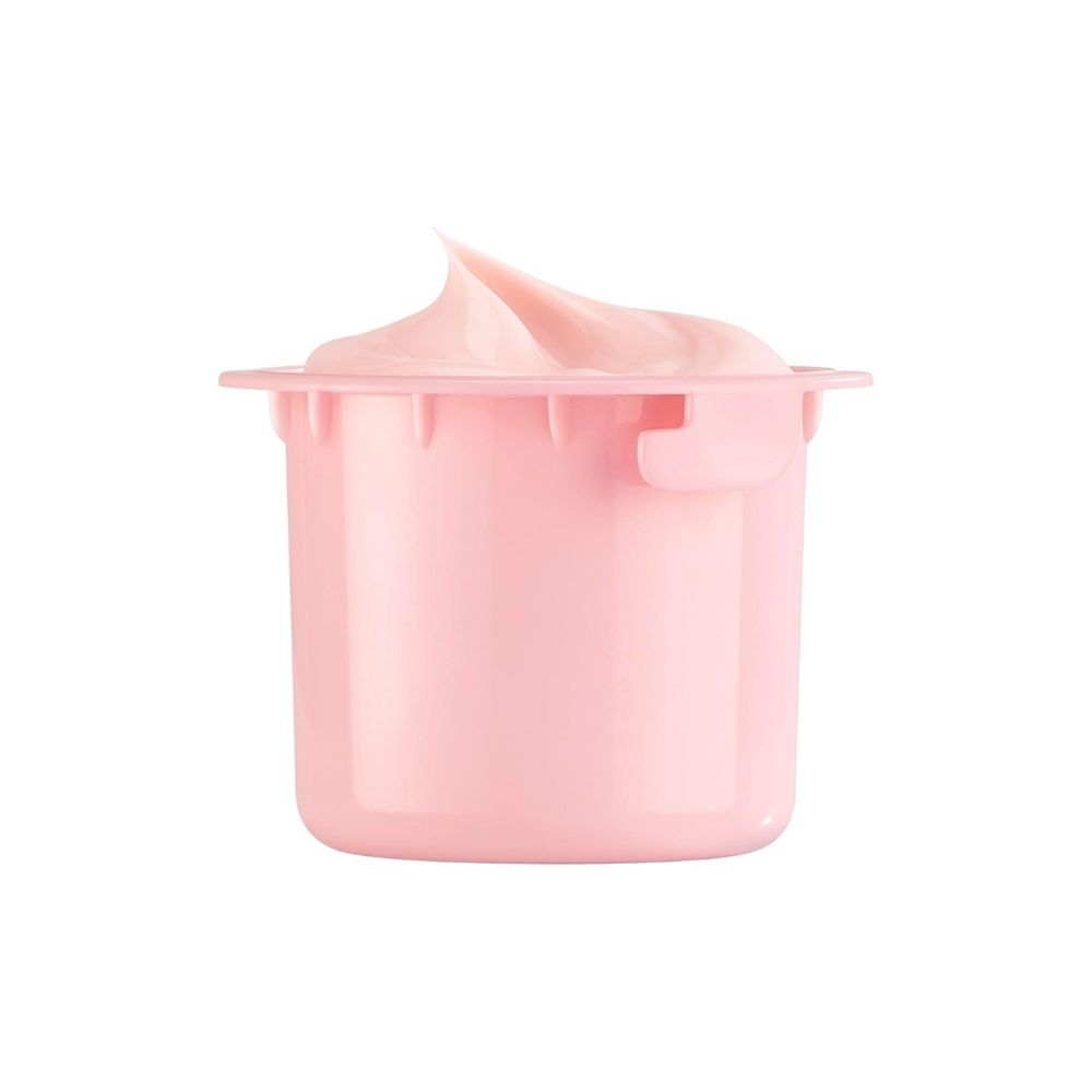 Ein kleiner rosa Behälter mit einer cremigen, rosa Substanz, die oben herausragt.