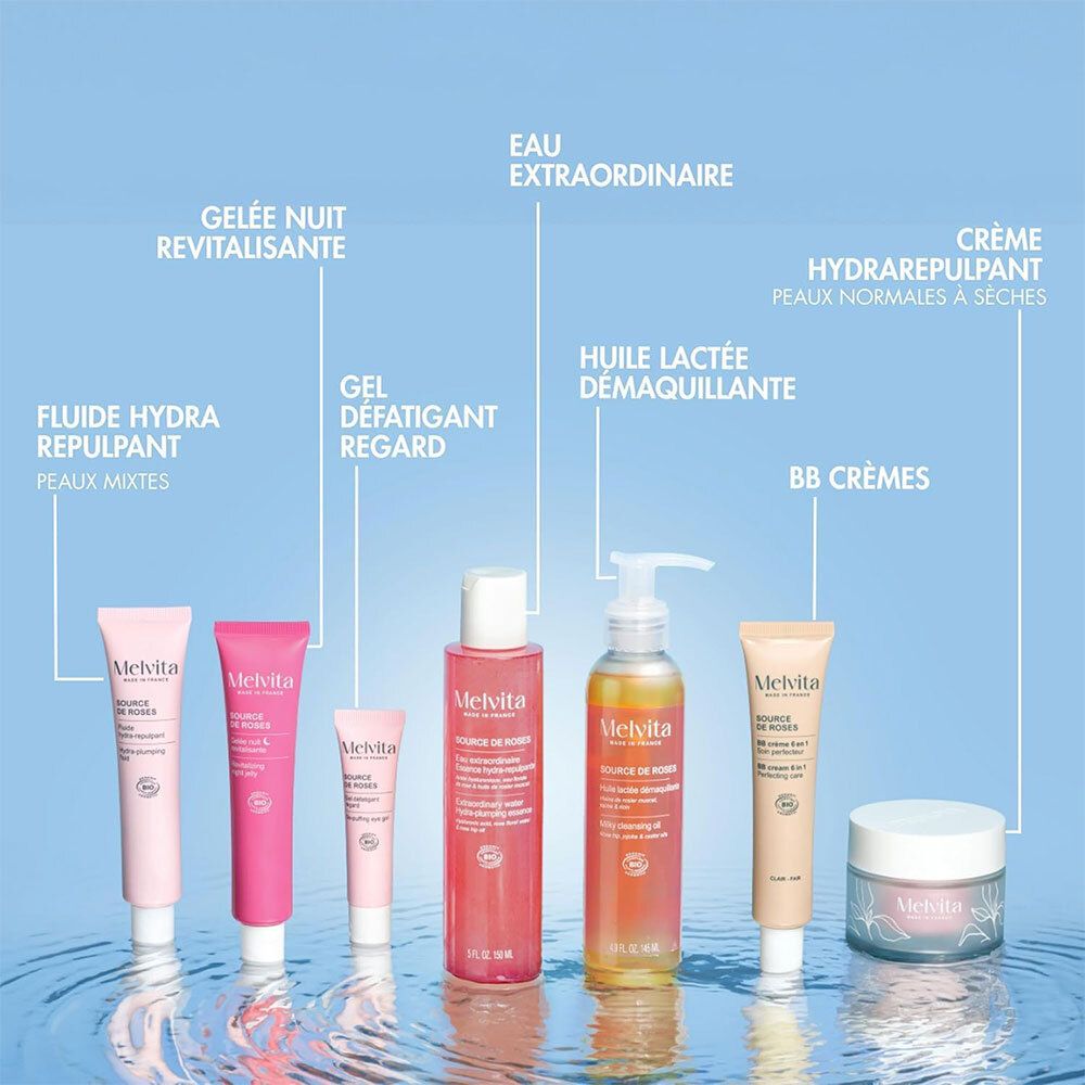 Verschiedene Melvita-Produkte. Rosa-Essenzflasche, andere Flaschen, Cremes und Tuben.