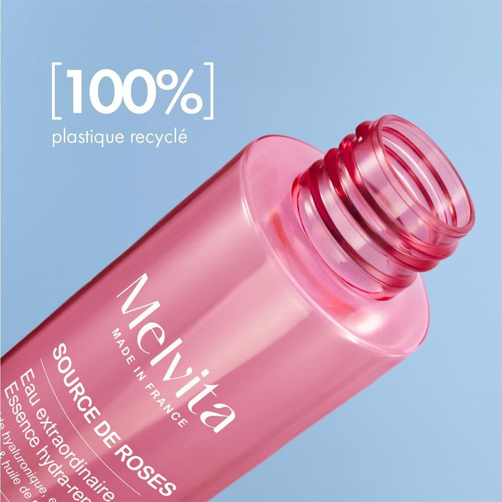 Rosa-Essenzflasche mit weißem Deckel. Text: 100% plastique recyclé.
