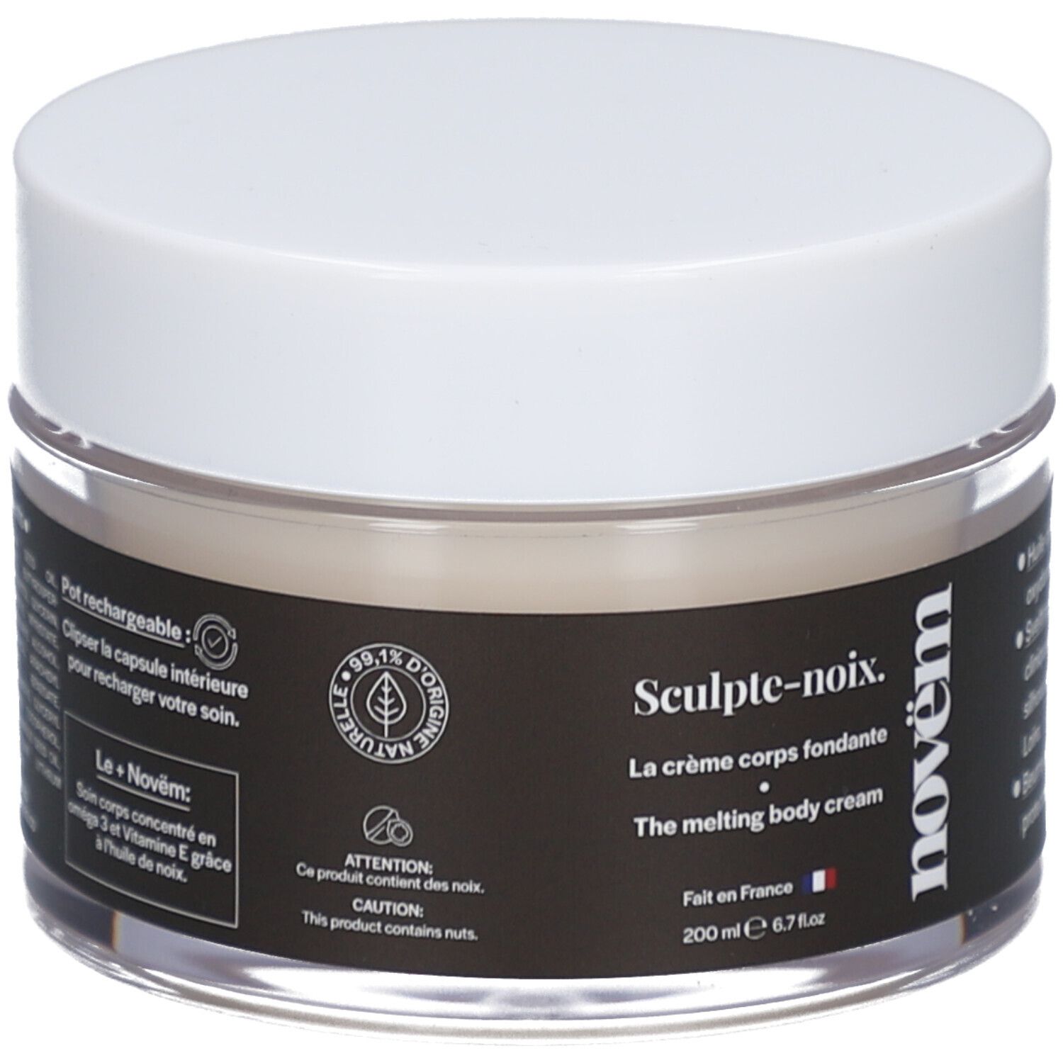 Cremetiegel mit weißem Deckel. Schwarzes Etikett mit Text: Sculpt-noix, La crème corps fondante, novëm. 200 ml. Durchsichtiges Glas.