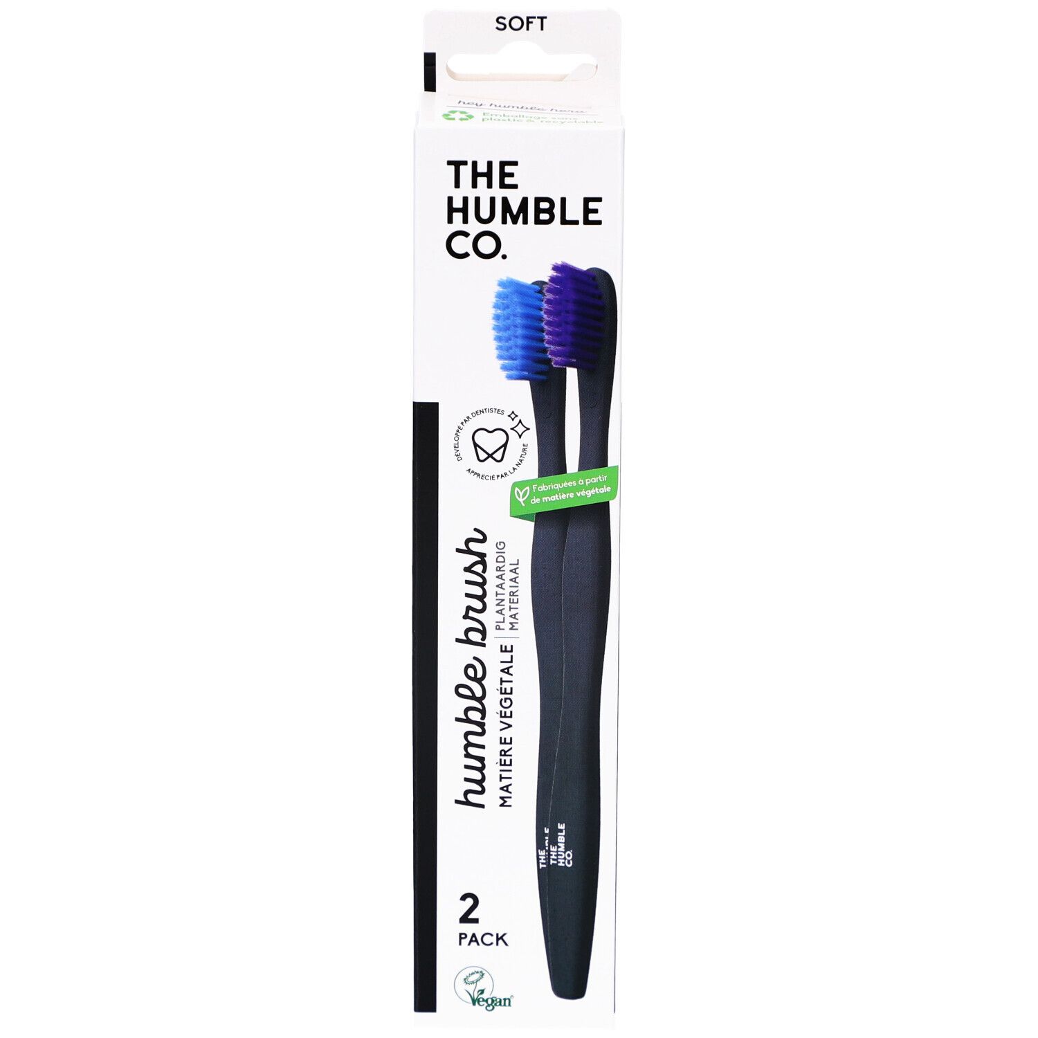 Zahnbürsten-Packung mit zwei schwarzen Zahnbürsten. Blaue und violette Borsten. Aufschrift: Humble Brush, 2er Pack.