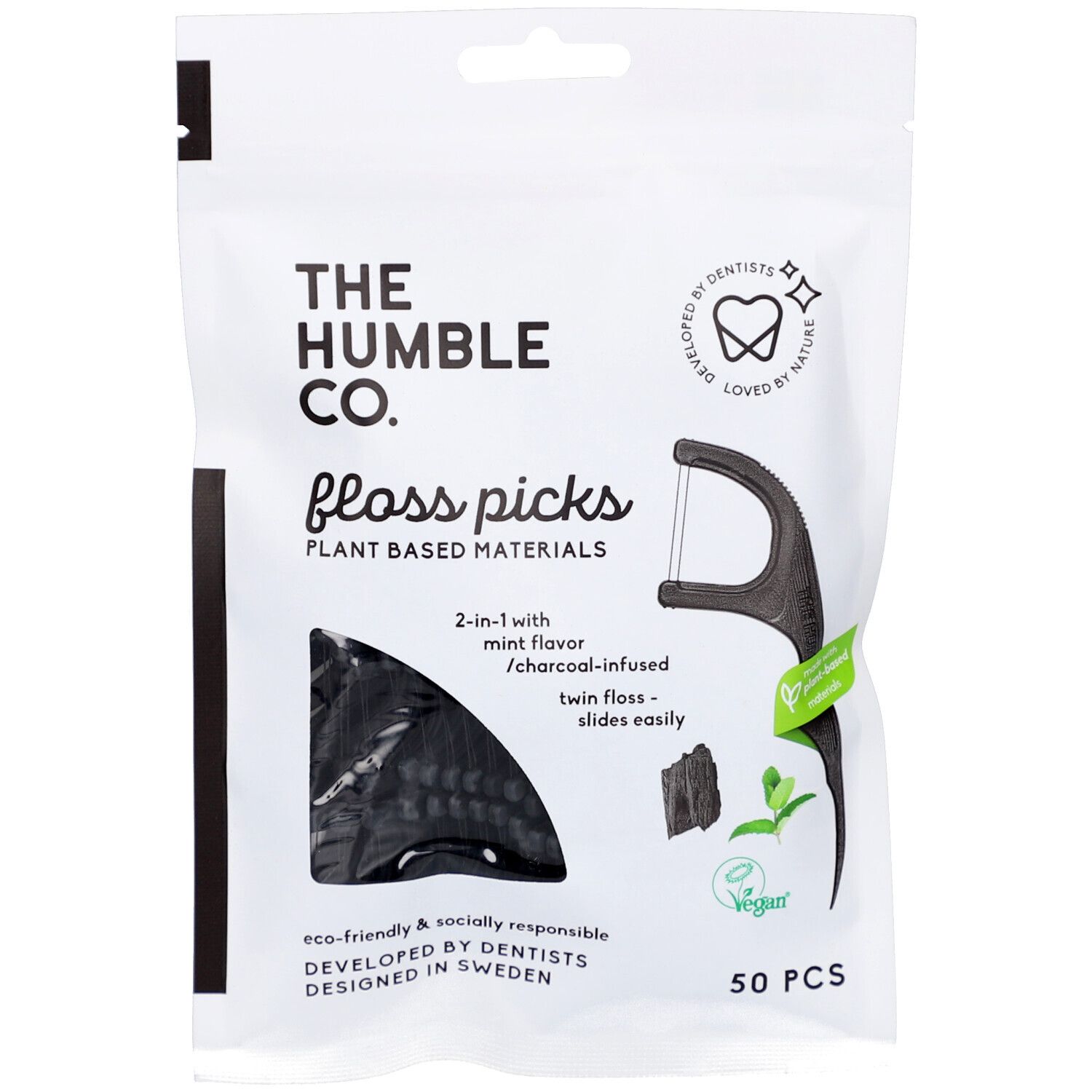 Weiße Verpackung mit schwarzen Zahnseide-Picks. Text: THE HUMBLE CO., Floss Picks, 50 Stück, vegan.