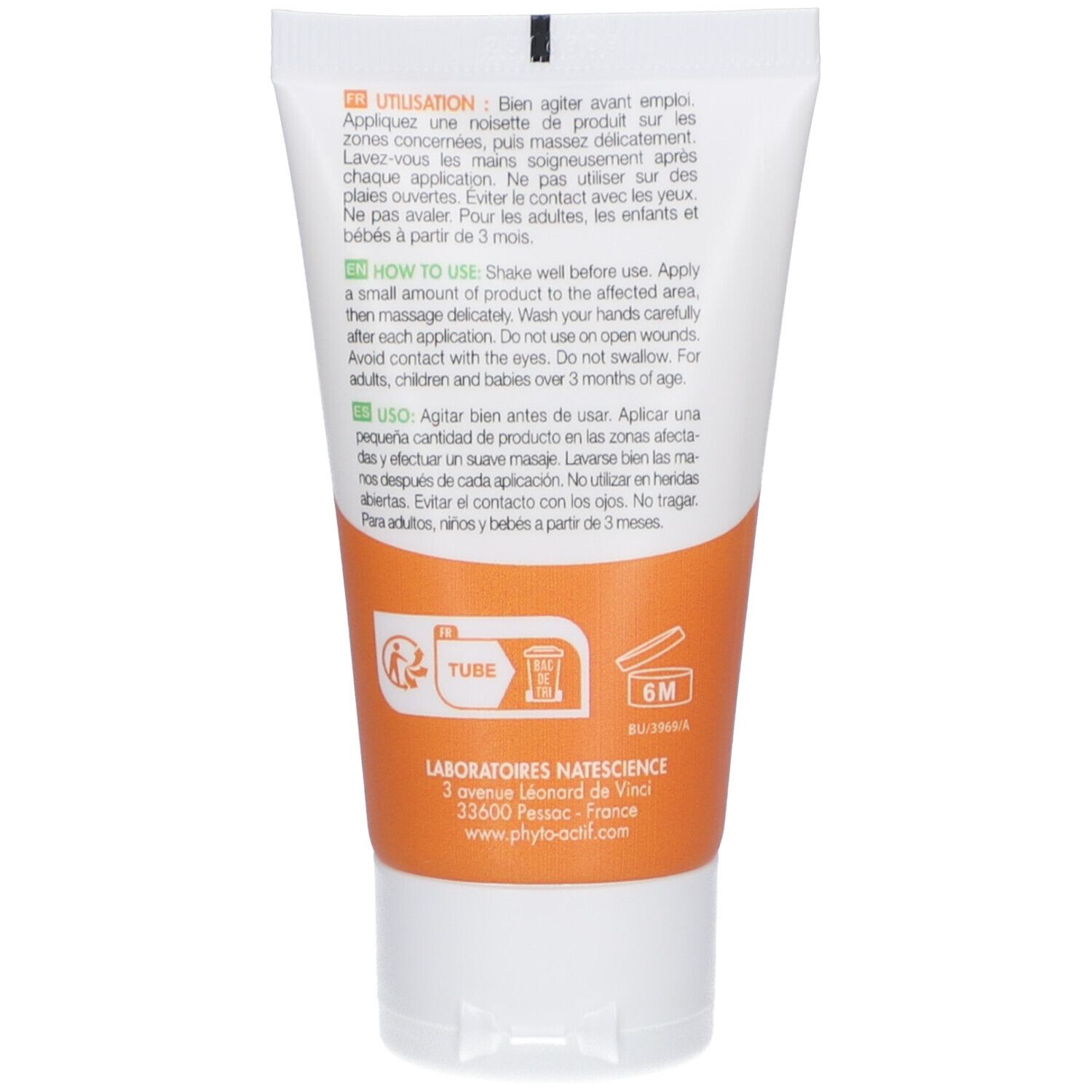 Dos d'un tube blanc avec étiquette orange. Texte multilingue. Instructions d'utilisation et ingrédients.
