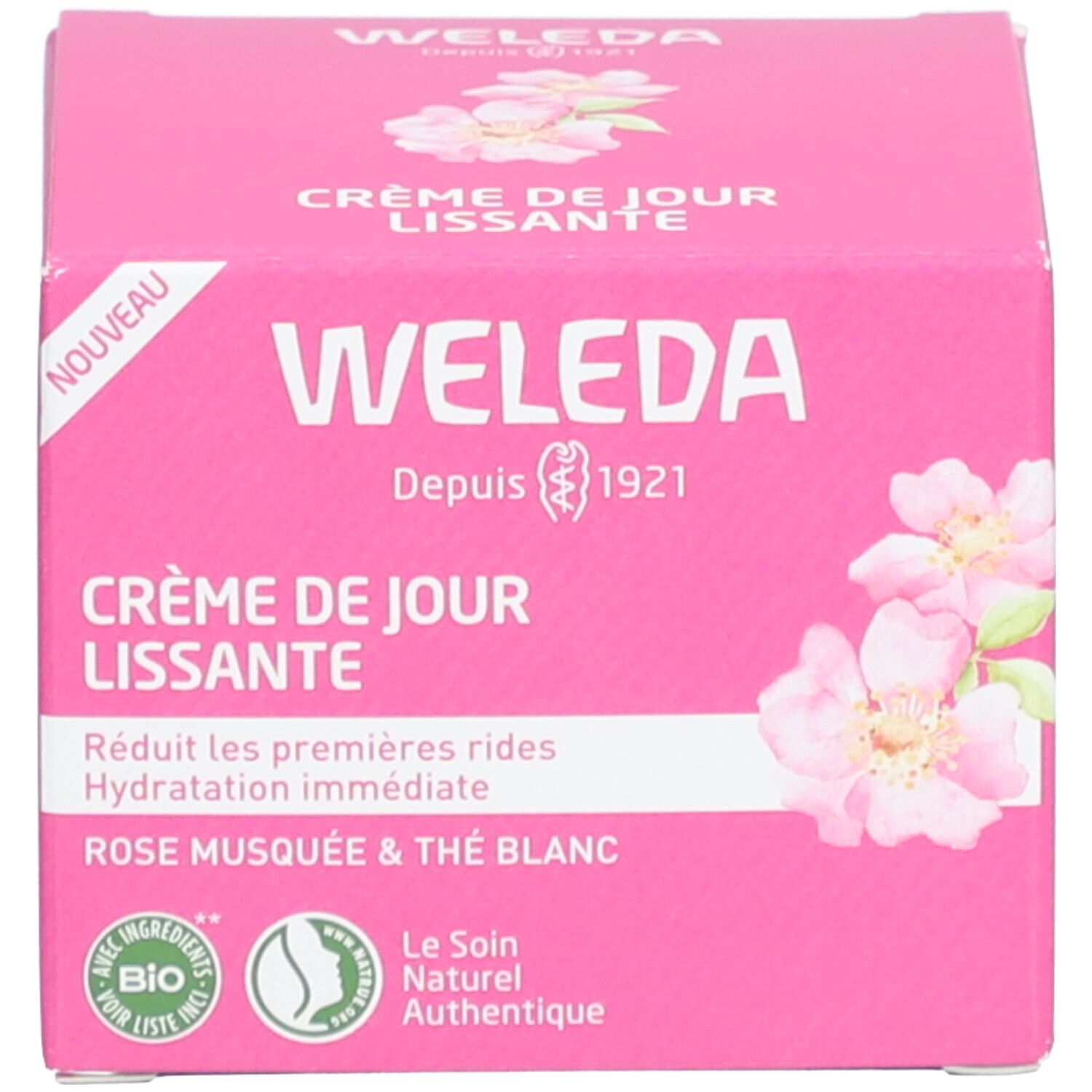Rosa Schachtel mit Produktnamen, Logo und Blüten. Text: Weleda, Crème de Jour Lissante, Rose Musquée & Thé Blanc. Bio-Siegel.