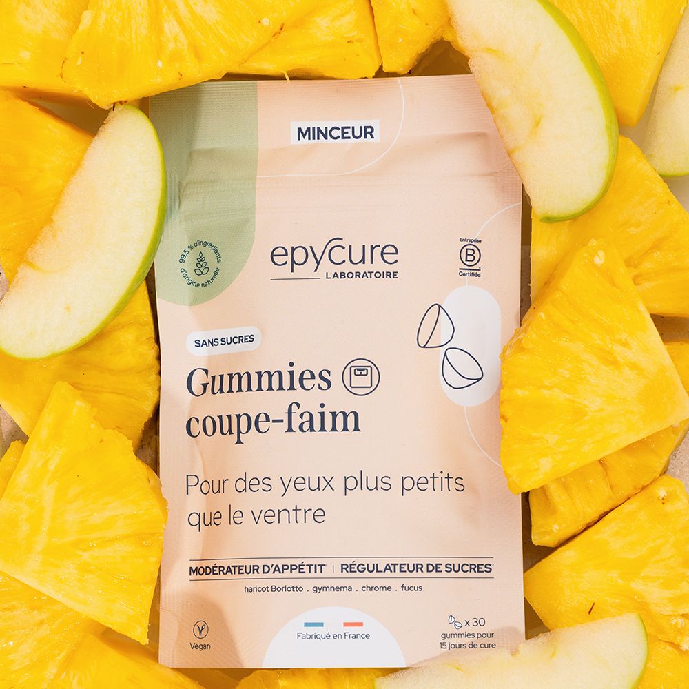 Beutel mit Gummies. Aufschrift: Epycure, Gummies coupe-faim, sans sucres. Umgeben von Ananas und Apfel.