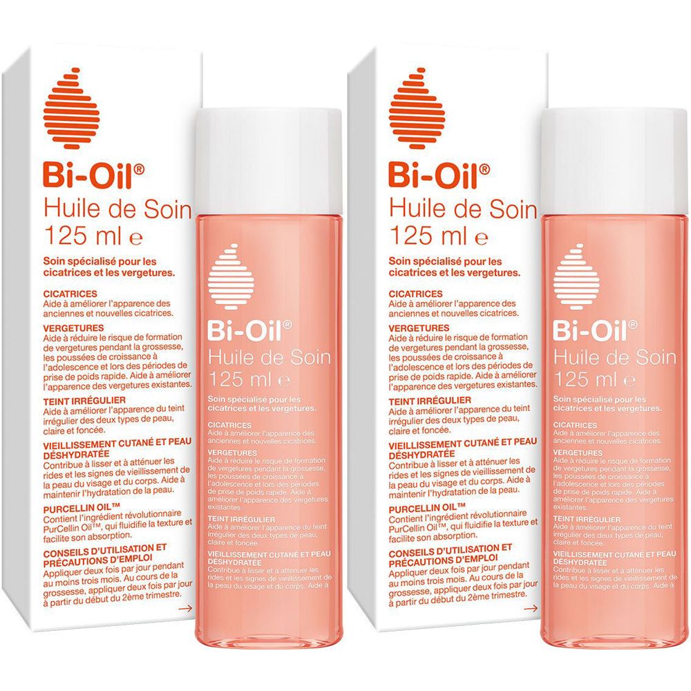 Zwei Flaschen Bi-Oil Huile de Soin, rosa Flüssigkeit, weißer Deckel, in Verpackung. Text: 125 ml e.