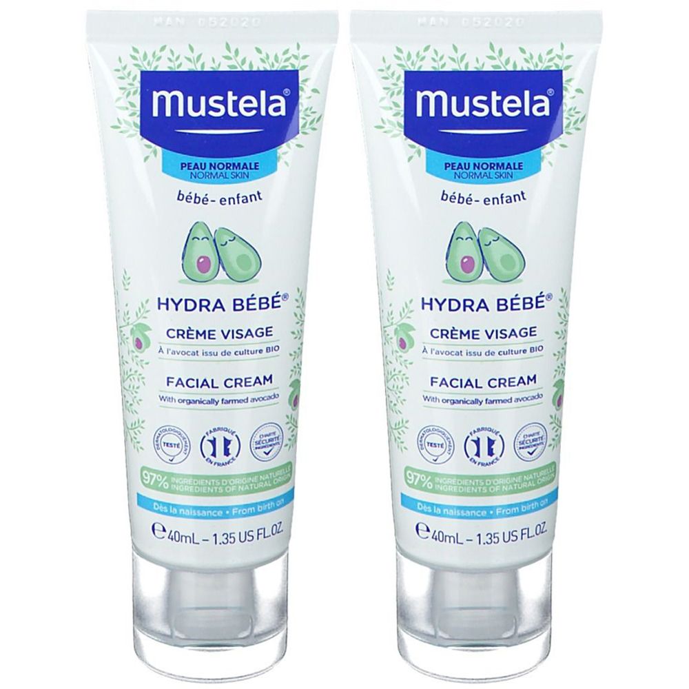 Zwei Tuben Creme. Aufschrift: Mustela, Hydra Bébé Crème Visage, Peau Normale, bébé-enfant. Mit Avocado-Illustration.