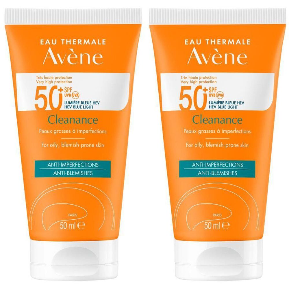 Deux tubes de crème solaire Avène Cleanance SPF50+. Tubes orange avec bouchon blanc. Texte: SPF50+, Cleanance, Anti-imperfections.