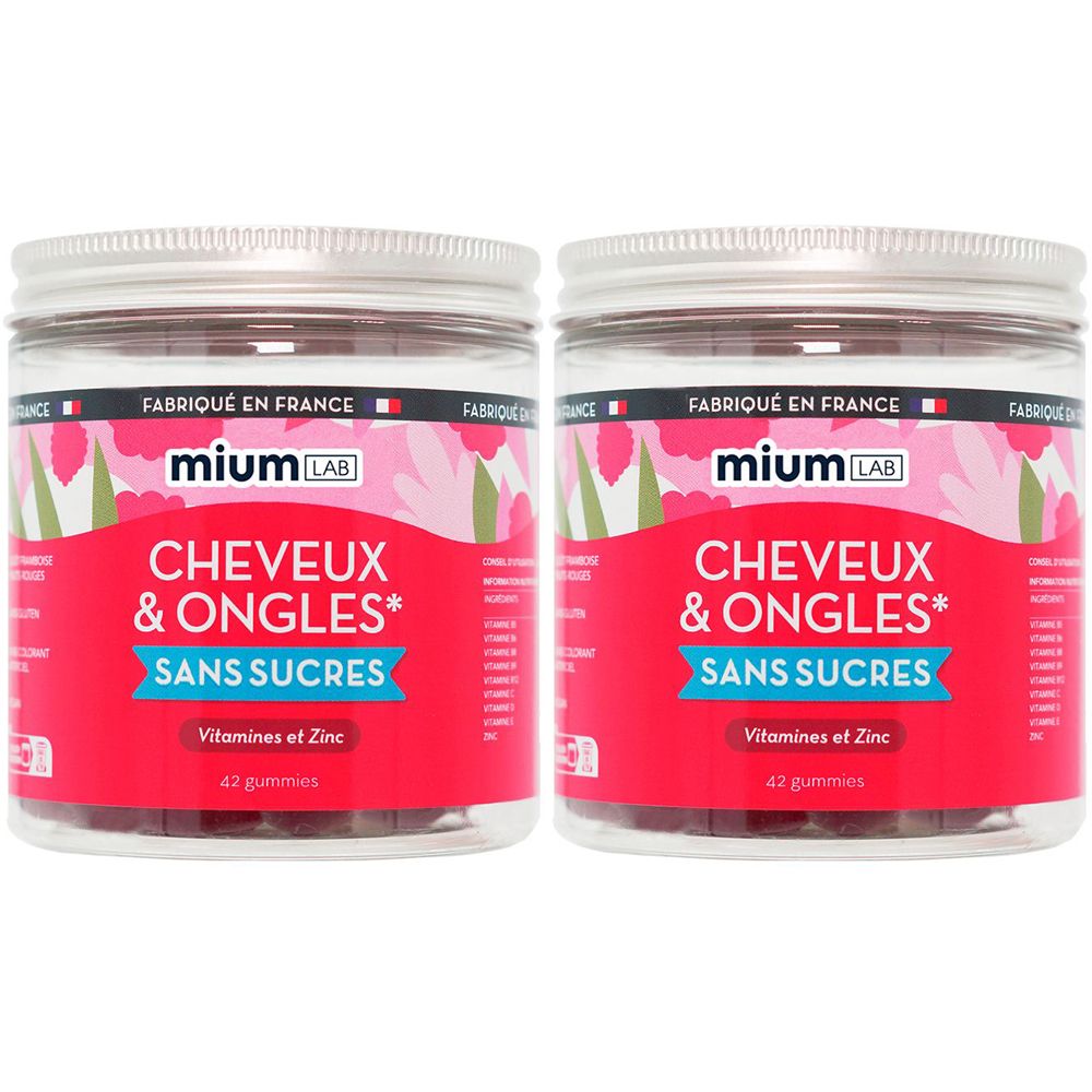 Zwei transparente Gläser mit rosa Etiketten. Aufschrift: CHEVEUX & ONGLES, SANS SUCRES, Vitamines et Zinc. Marke: mium LAB. 42 Gummies.