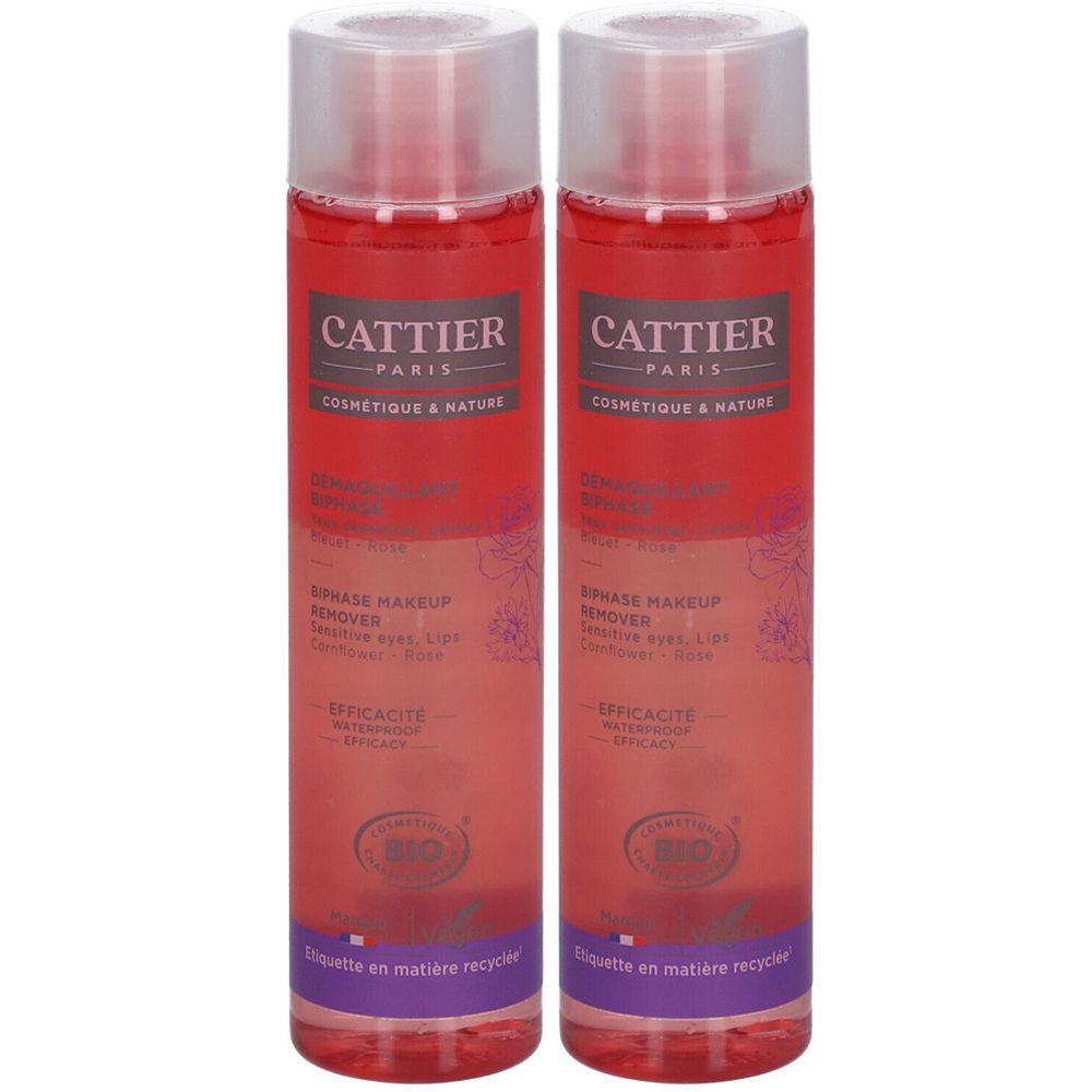 Deux flacons de démaquillant biphase. Inscription CATTIER PARIS. Label avec certification biologique. Flacons transparents.