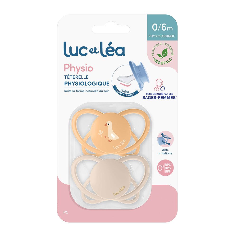 Deux sucettes Luc et Léa, jaune et beige, dans un emballage. Forme physiologique. Recommandé pour 0/6 mois.