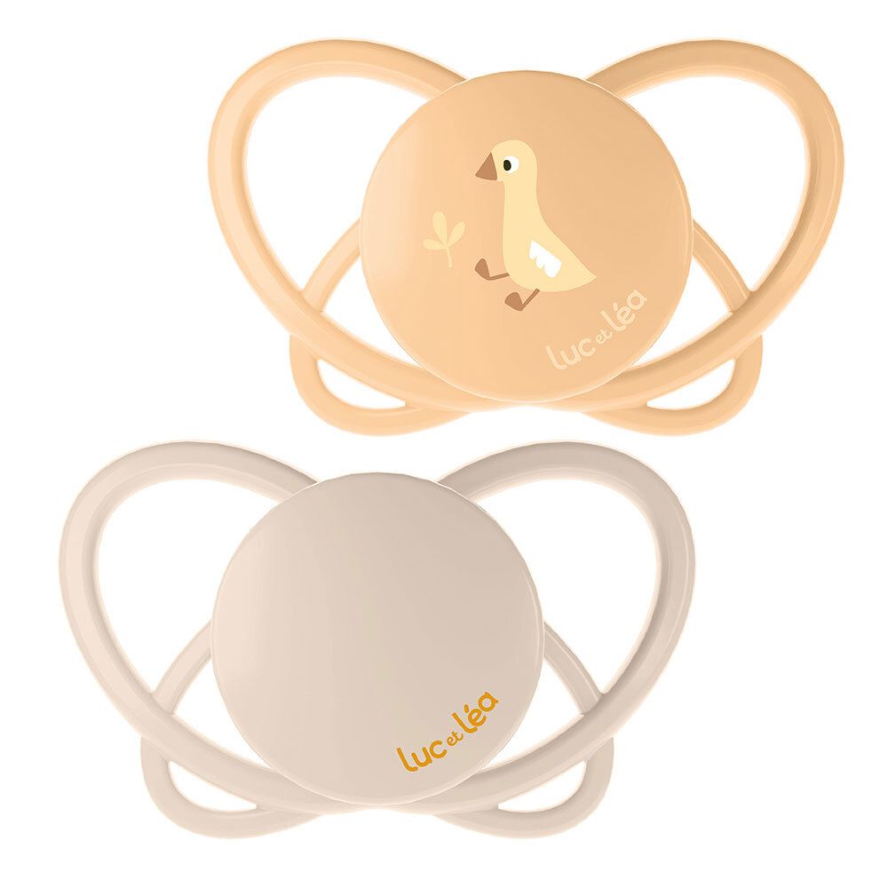 Deux sucettes Luc et Léa, jaune et beige. Forme physiologique. Motif canard.