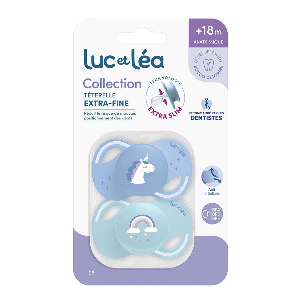 Verpackung mit zwei Schnullern. Marke Luc et Léa. Blaue und hellblaue Schnuller mit Einhorn- und Regenbogenmotiven. Anatomisch, extrafein.