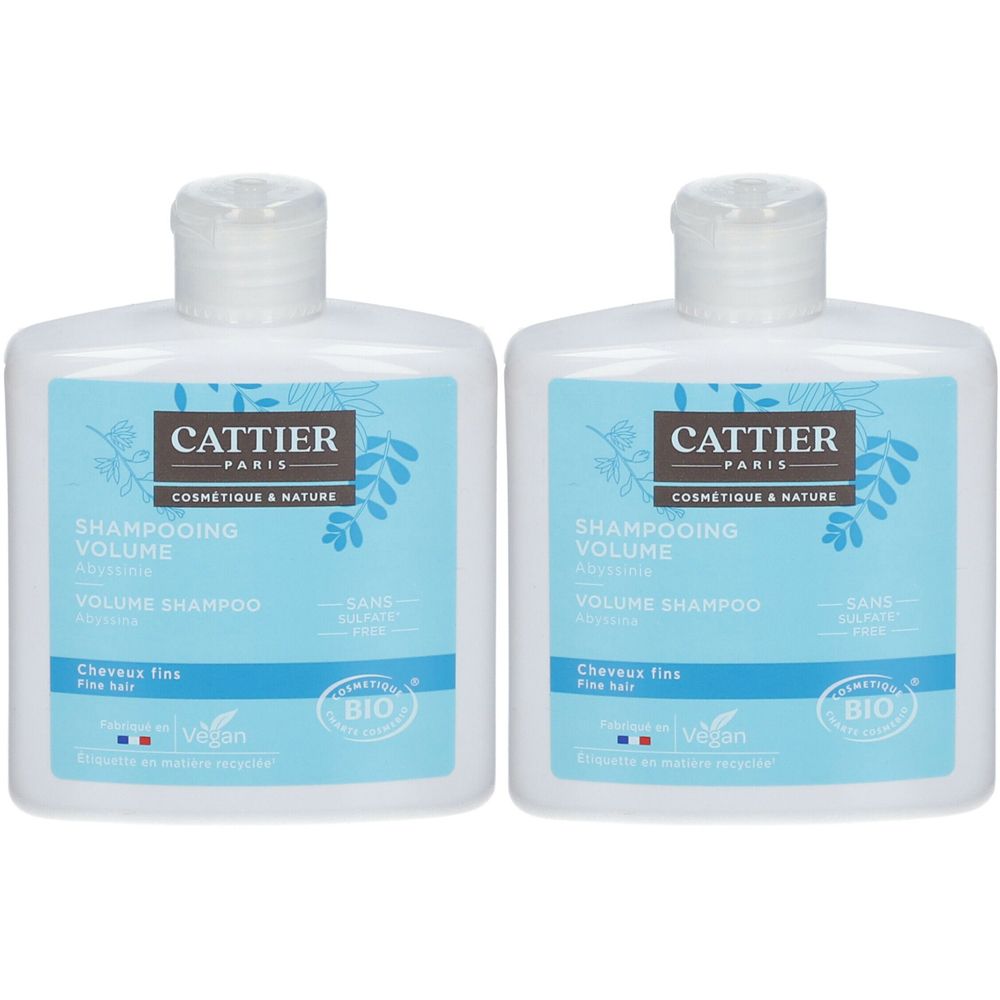 Zwei weiße Flaschen mit blauem Etikett. Aufschrift: Cattier Paris, Shampooing Volume, Bio-Zertifizierung, Vegan.