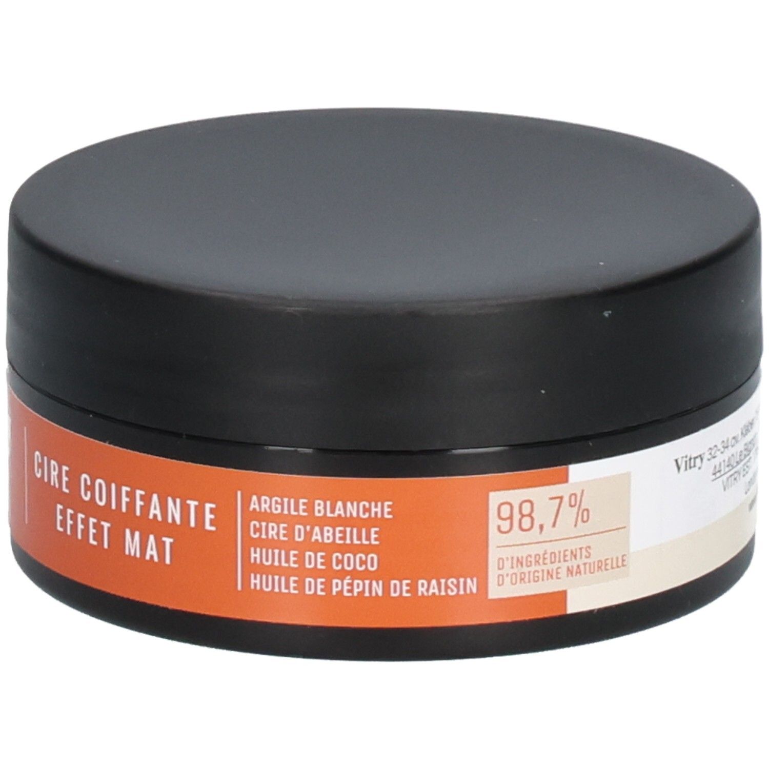 Schwarze Dose mit orangefarbenem Etikett. Text: "CIRE COIFFANTE EFFET MAT". Aufgedruckt: Inhaltsstoffe, 98,7% Inhaltsstoffe natürlichen Ursprungs.