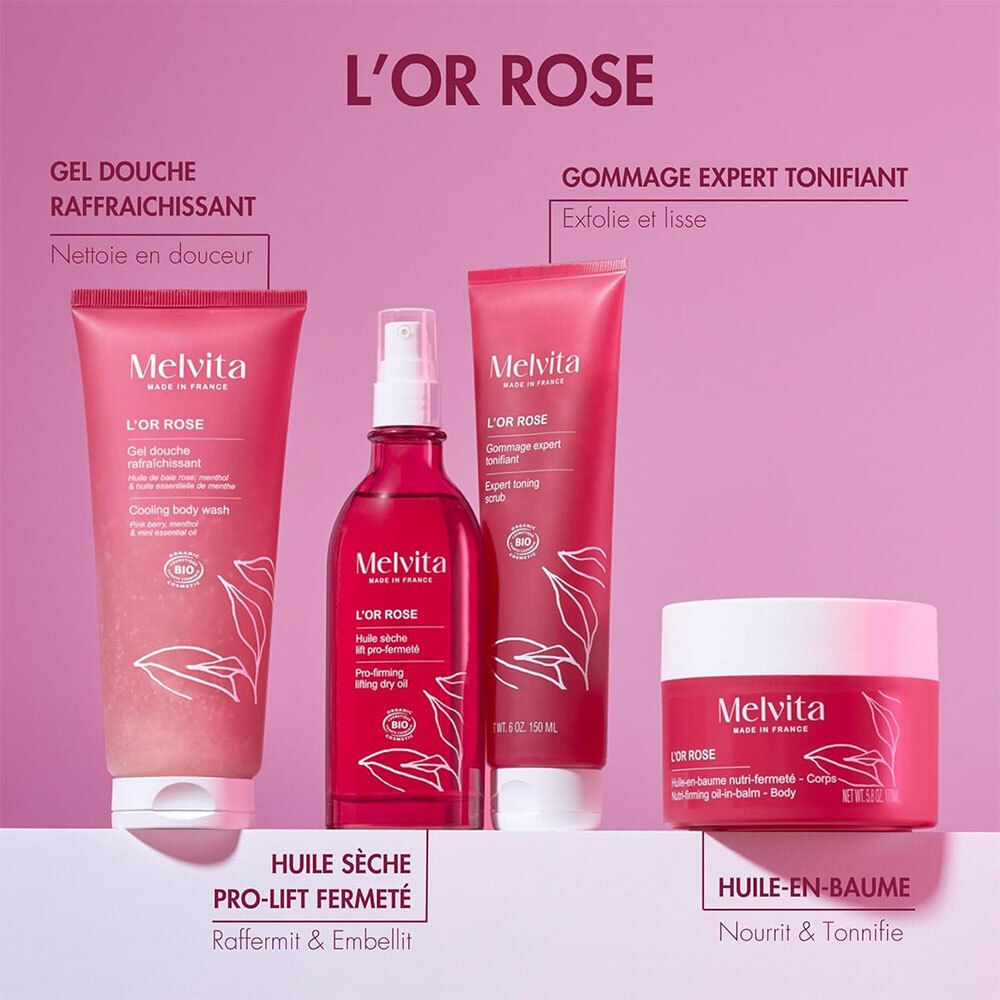 Produktreihe von Melvita L'OR ROSE. Duschgel, Körperspray, Peeling und Körperbalsam. Rosa Verpackung.