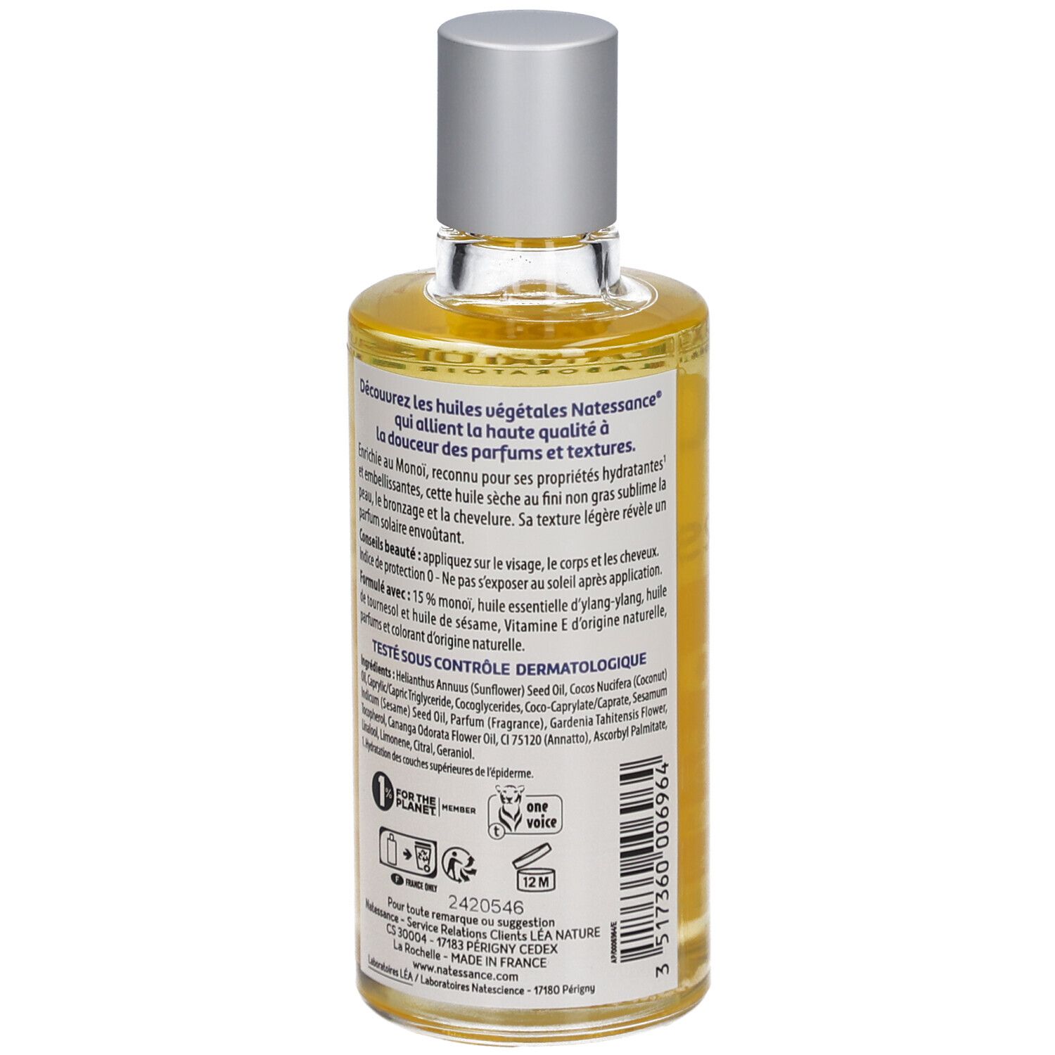 Flasche mit gelbem Öl. Aufschrift: Natessance Monoï, Huile sèche. Mit Blüten-Dekor.