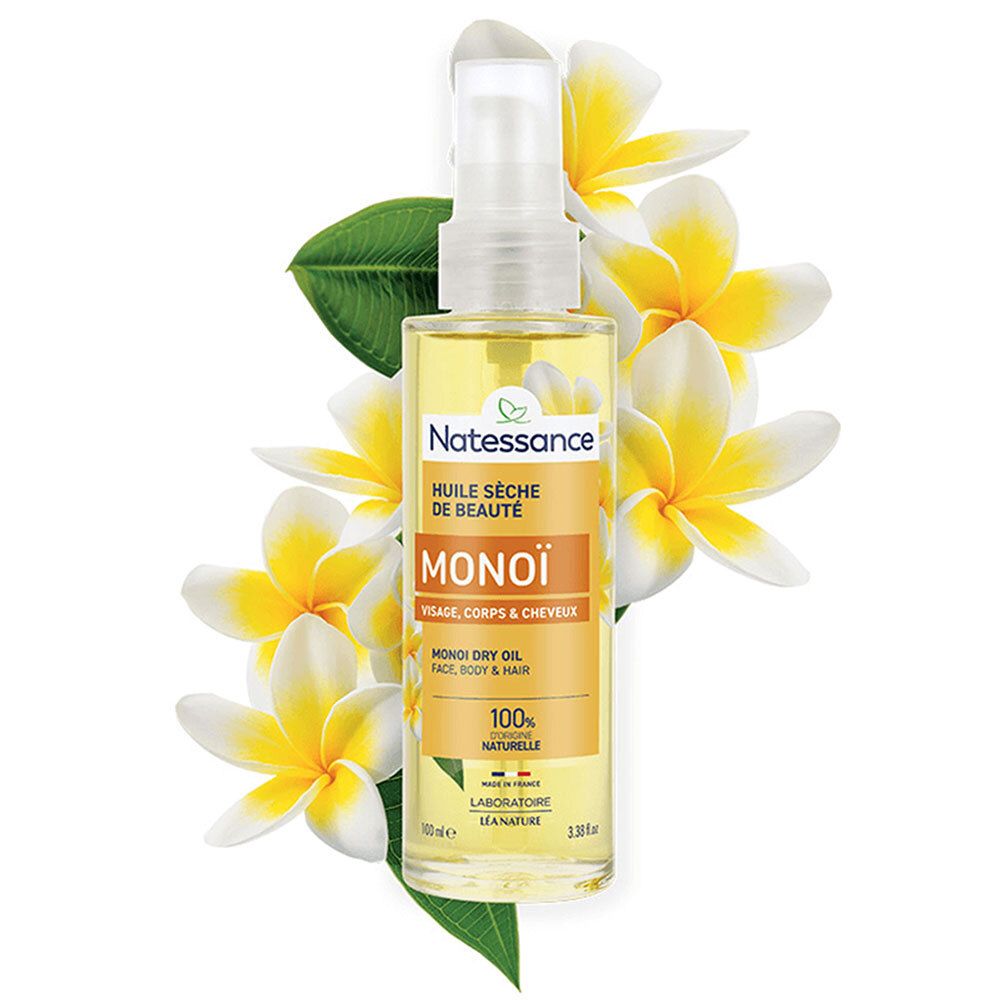 Ölflasche mit Sprühkopf, umgeben von Blüten. Aufschrift: Natessance Monoï. 100% natürlich.