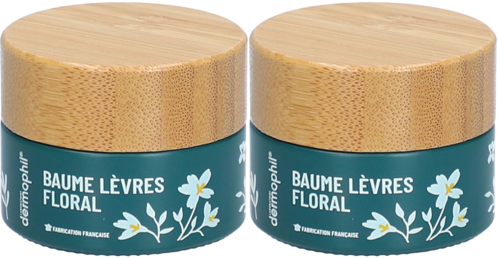 Zwei Tiegel Lippenbalsam mit Holzdeckel. Aufschrift: Baume Lèvres Floral, dermophil. Französische Herstellung.