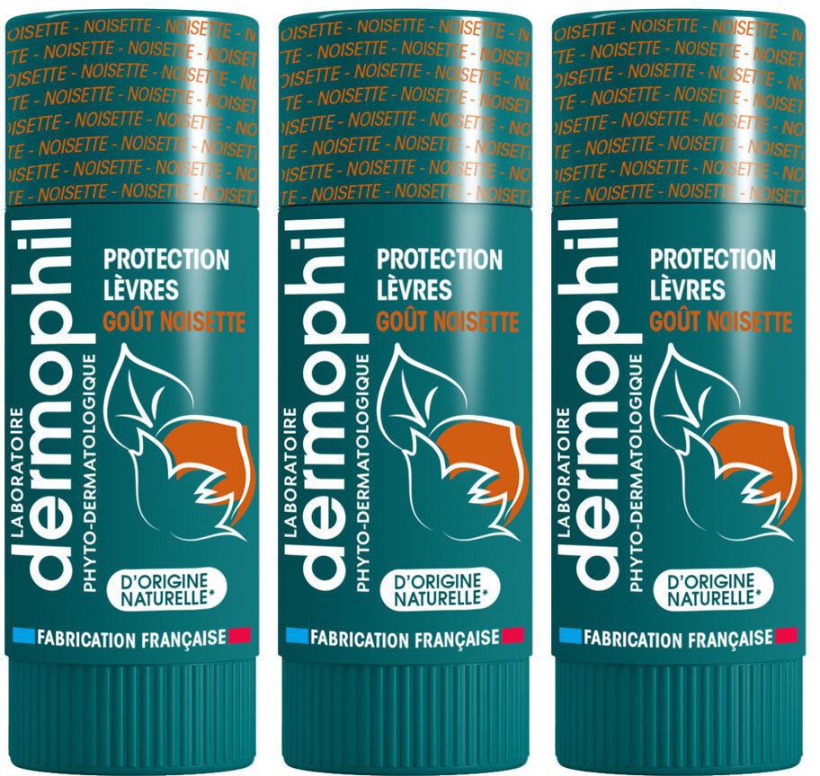 Drei Lippenpflegestifte. Grün-weiß-goldene Verpackung. Aufschrift: Dermophil, Schutz, Haselnussgeschmack. Französische Herstellung.