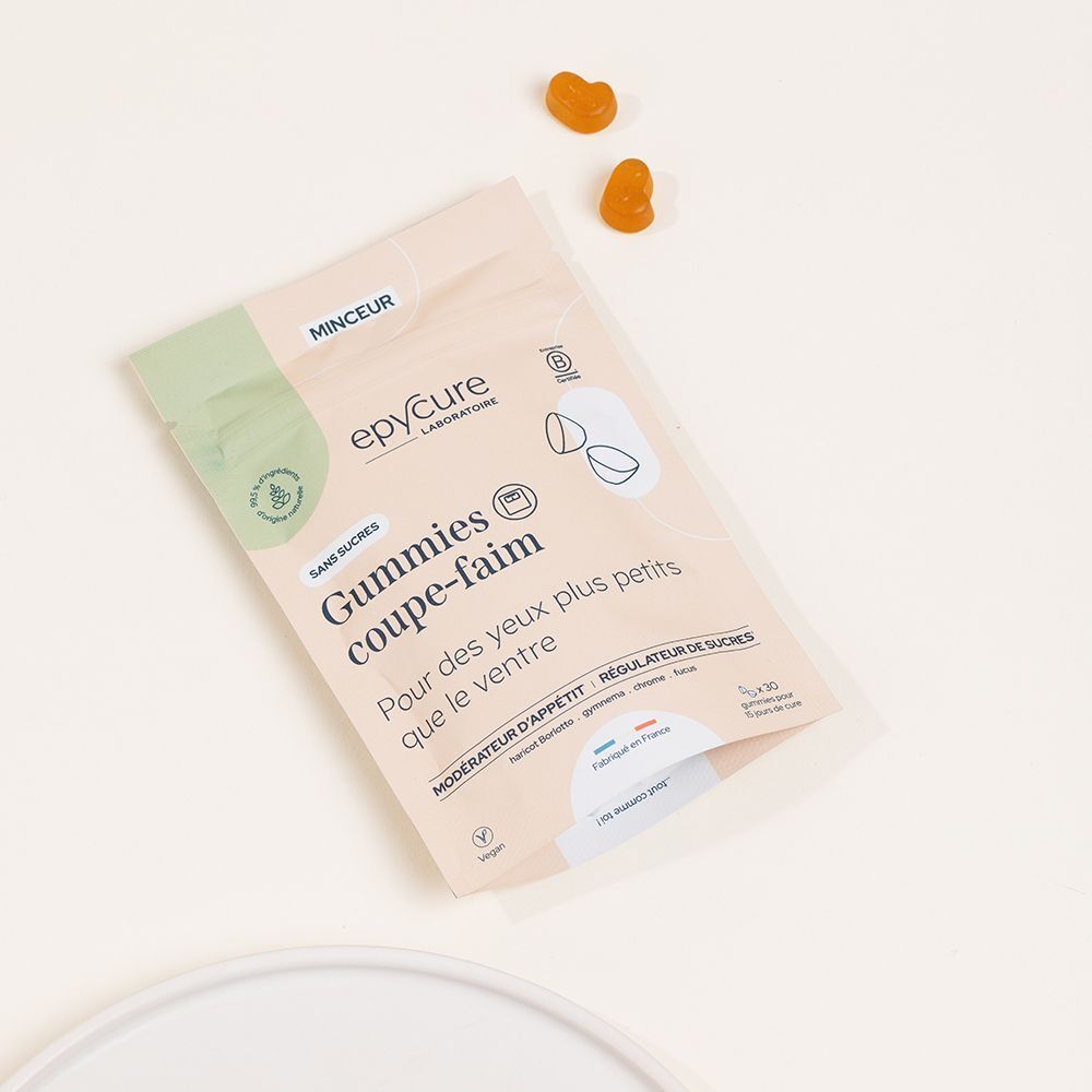 Beutel mit Gummies. Aufschrift: Epycure, Gummies coupe-faim. Vegan. Ohne Zucker. Zwei orangefarbene Gummies daneben.