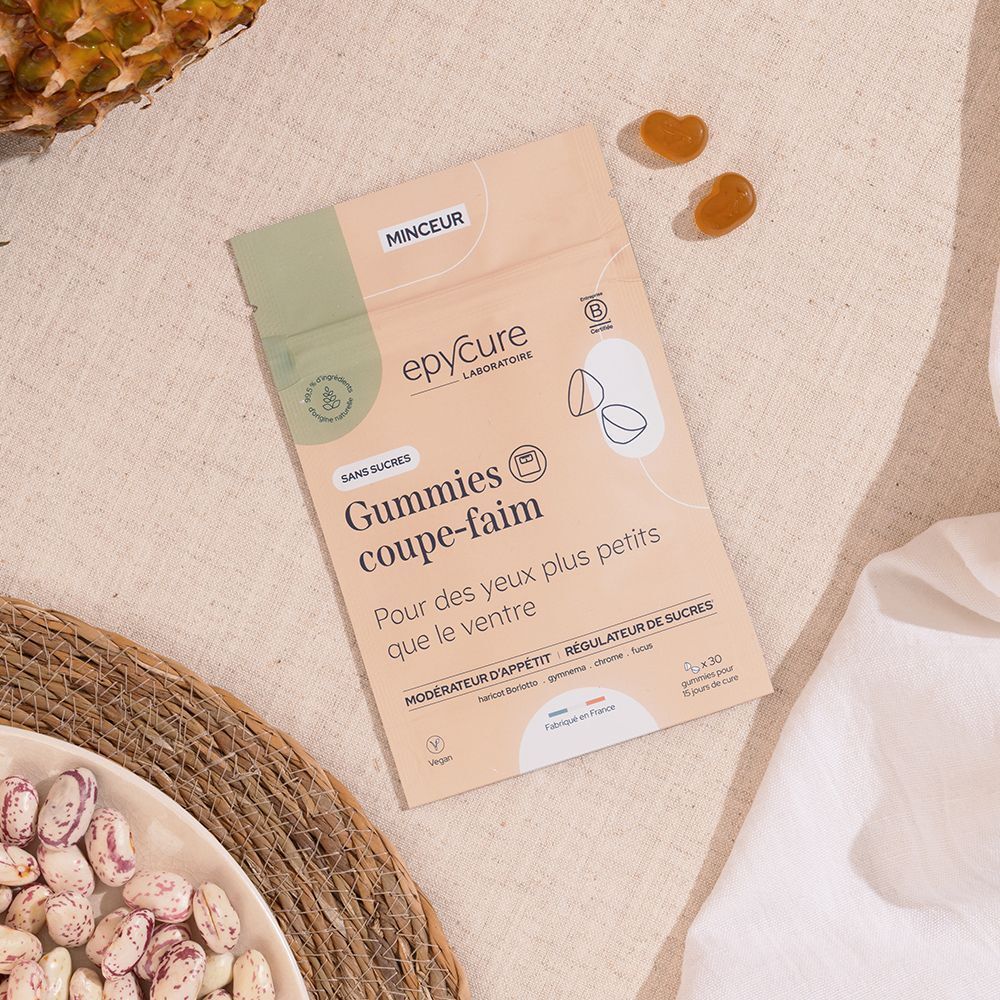 Beutel mit Gummies, neben Bohnen und zwei Gummies. Aufschrift: Epycure, Gummies coupe-faim. Vegan. Ohne Zucker.